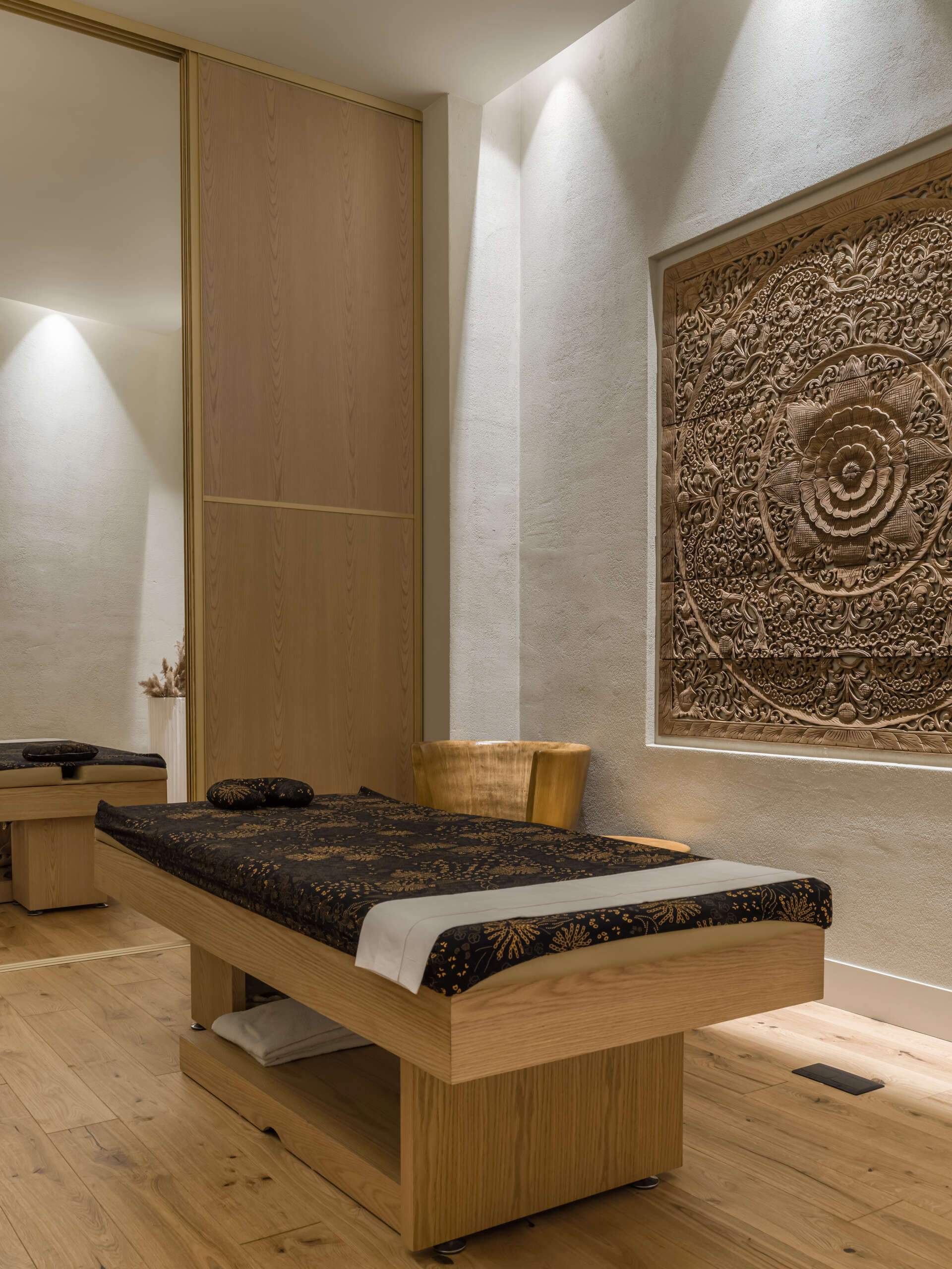 Step into a sensory cocoon on the first floor of SIAM SPA, where flowing corridors, sand-toned textures, and curved walls evoke the feeling of a peaceful, natural cave. Intimate lighting and tactile materials create a tranquil setting for massage and deep relaxation.