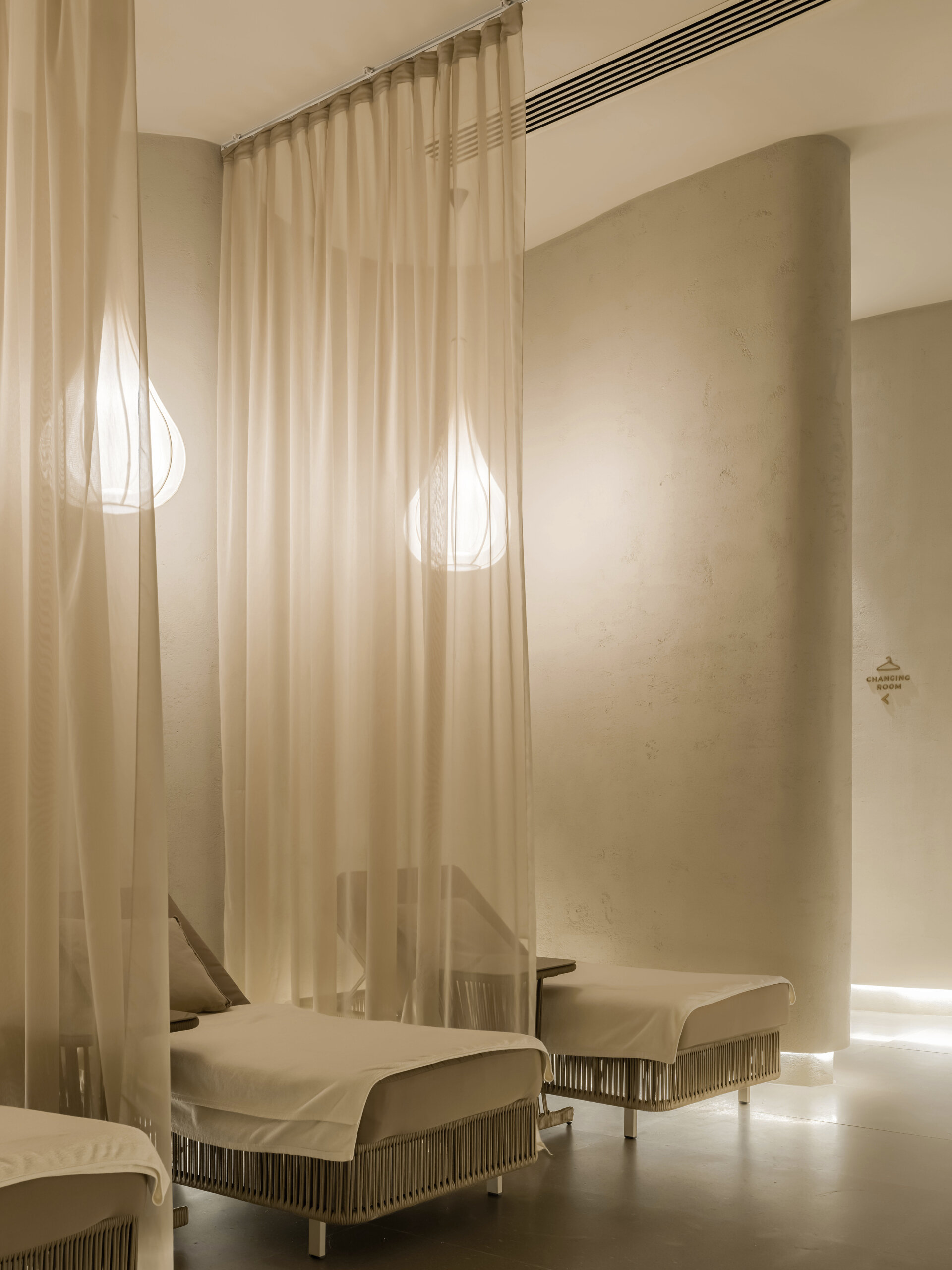 Step into a sensory cocoon on the first floor of SIAM SPA, where flowing corridors, sand-toned textures, and curved walls evoke the feeling of a peaceful, natural cave. Intimate lighting and tactile materials create a tranquil setting for massage and deep relaxation.