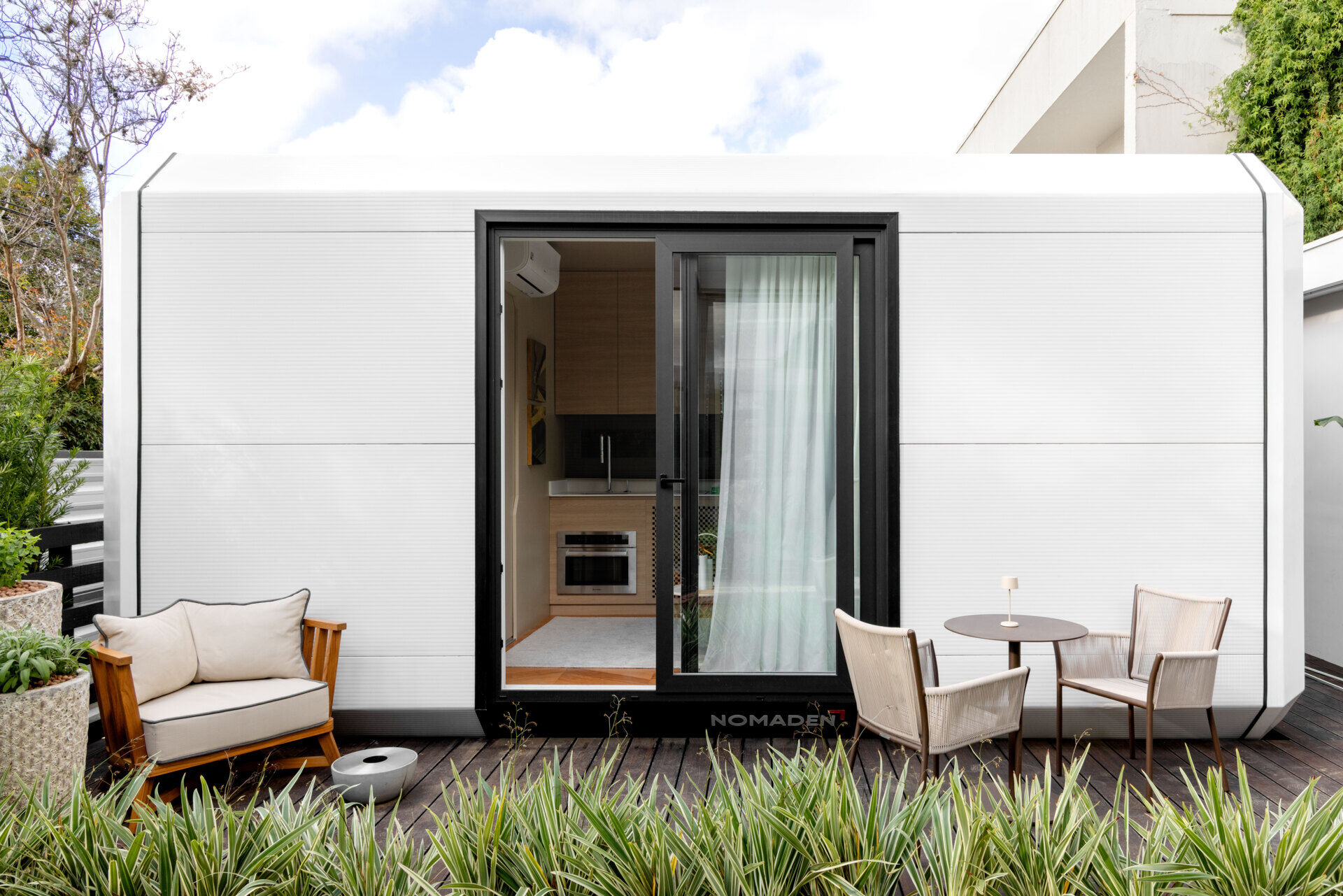 This modular tiny house by Gabriela Casagrande blends minimal design with natural surroundings. Large openings invite in sunlight and fresh air, while the compact form sits lightly on the land. A serene example of sustainable living in just 194 square feet.