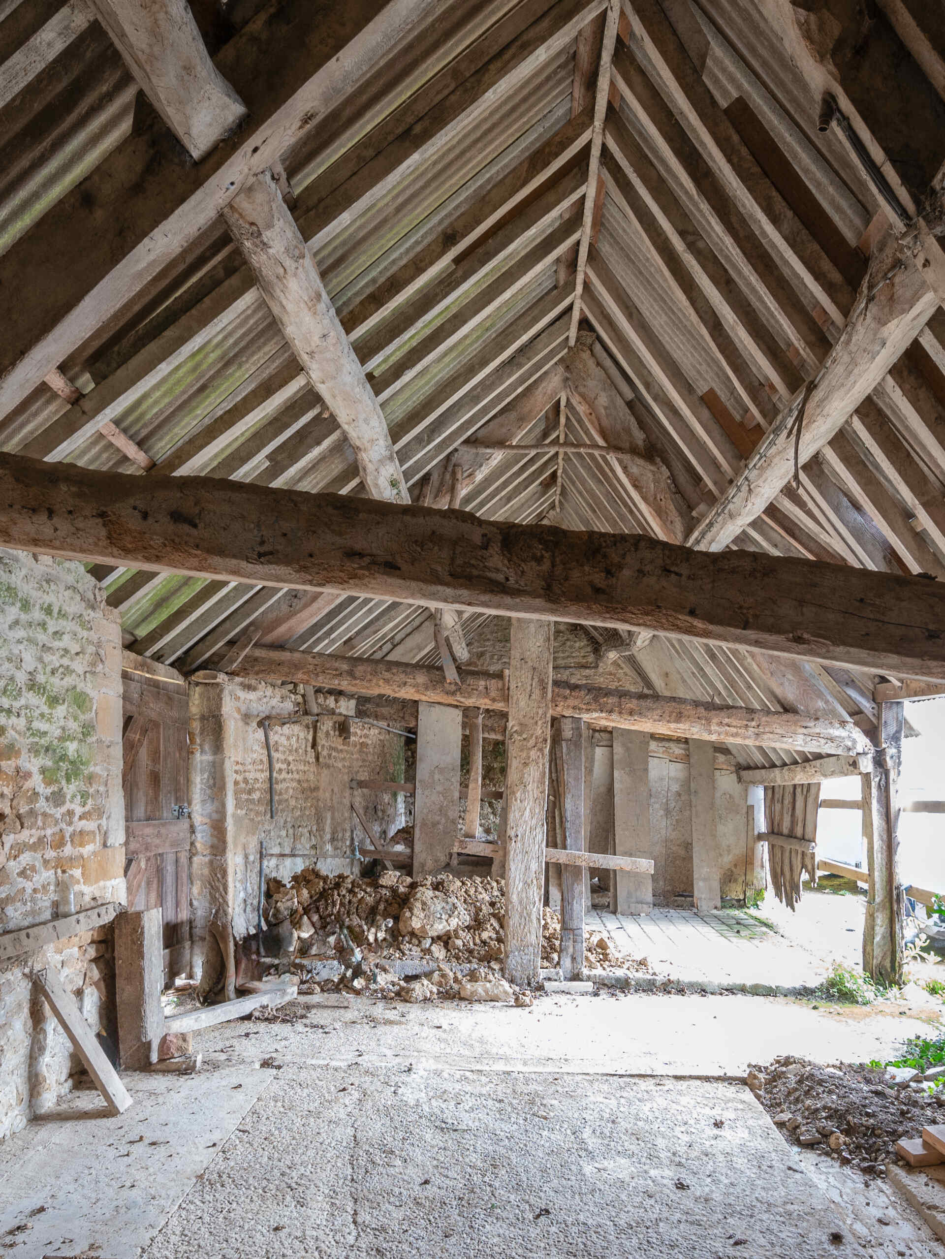 This cowshed was transformed into a two bedroom home that kept some of the original features.