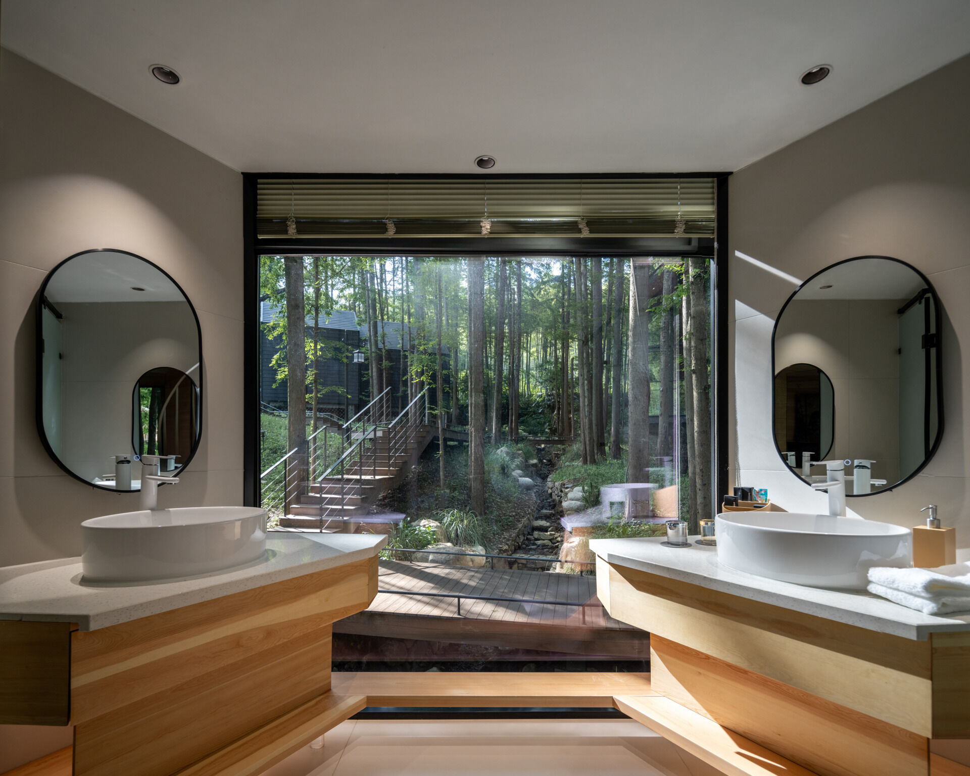 Lightweight and modular, these cabins take cues from pinecones and tree forms. Elevated design preserves the forest floor, while angled rooflines echo the grove’s vertical rhythm.