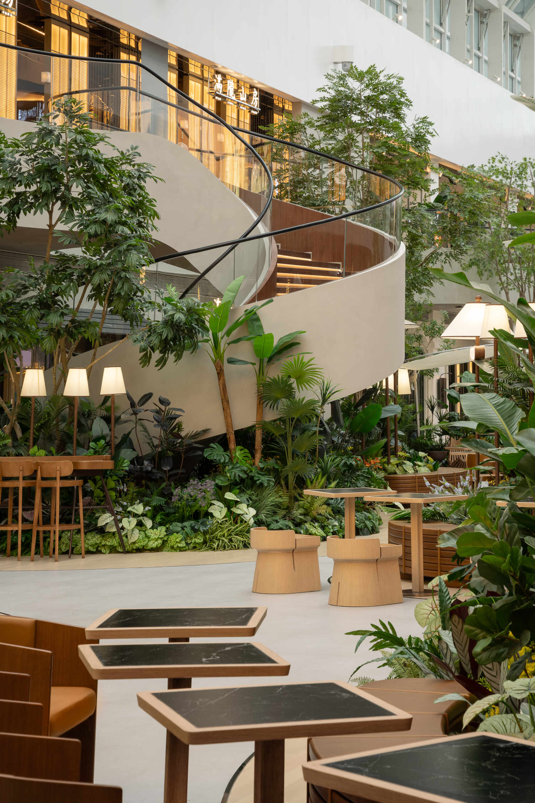 A vine-like spiral staircase rises gracefully through the atrium, serving as both a sculptural element and a gentle transition between floors. Light, fluid, and rooted in the garden aesthetic.
Under-stair lighting adds a gentle glow to each tread, guiding movement without disrupting the calm atmosphere. Subtle, functional, and beautifully integrated into the space.