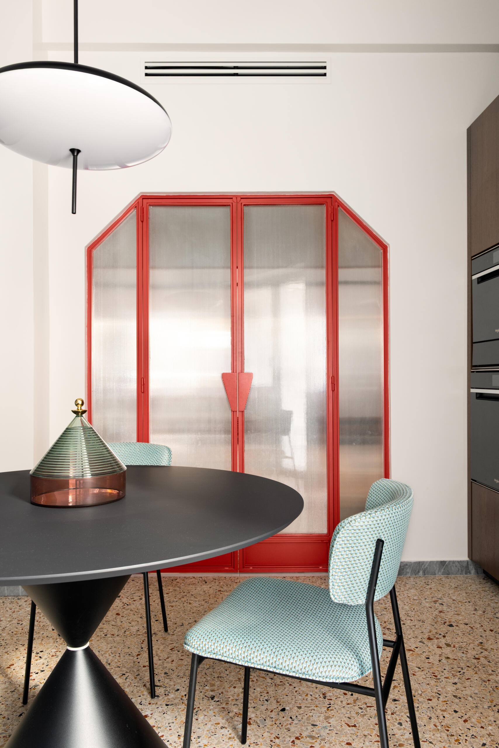 The kitchen in this renovated 1960s home was reconfigured for better flow, adding a casual breakfast table for everyday comfort.