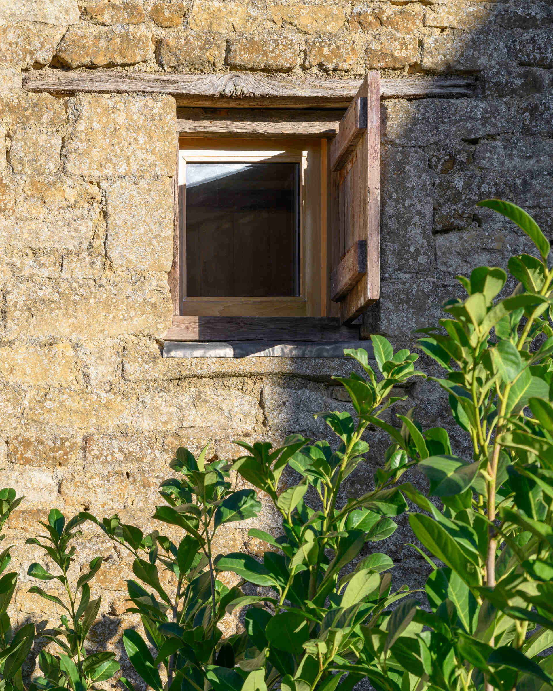 This cowshed was transformed into a two bedroom home that kept some of the original features.