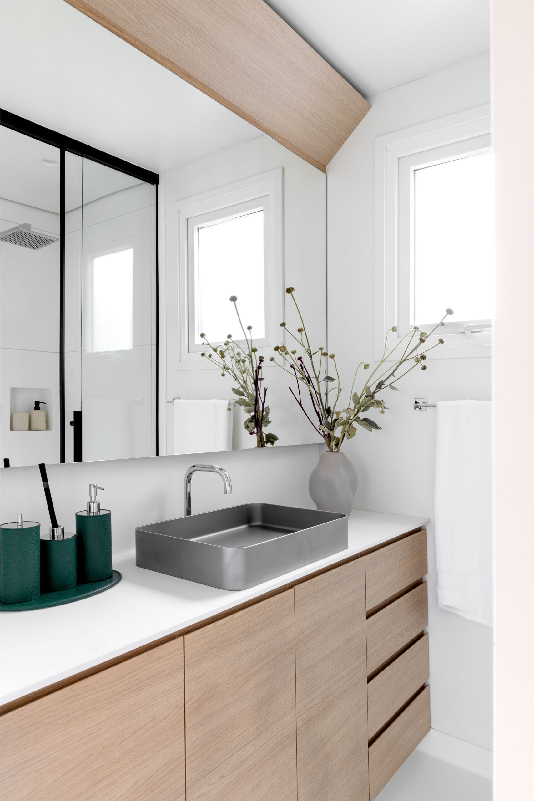 Small but luxurious, the bathroom pairs natural materials with clean-lined fixtures for a calming, spa-like feel. Thoughtfully lit and beautifully detailed, it’s proof that even the smallest spaces can be both functional and serene.