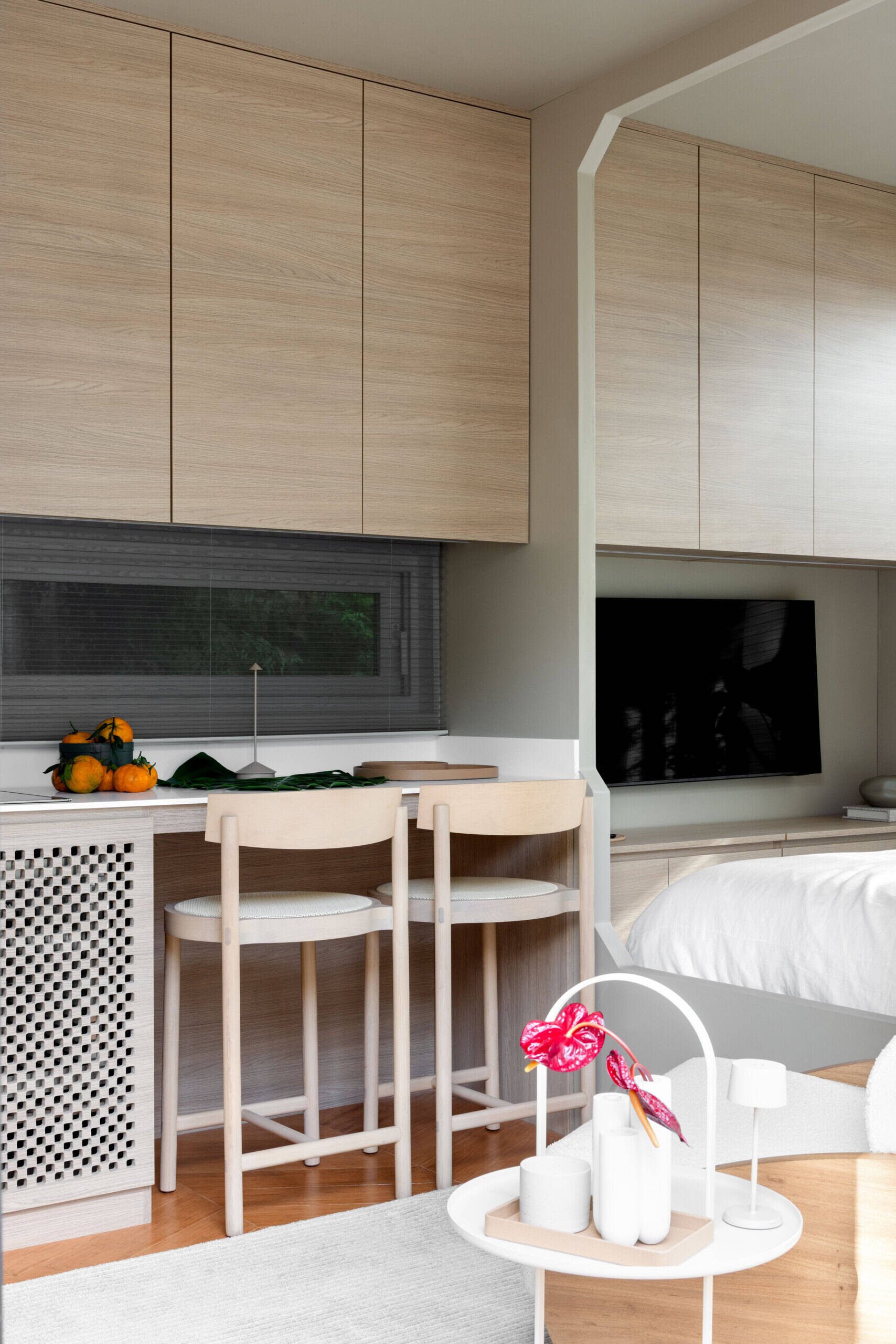Inside this tiny house, every inch is intentional. Warm bamboo finishes, custom furniture, and smart tech create a calm, modern space that feels far bigger than its footprint. The open layout flows seamlessly between living, kitchen, and sleeping areas.