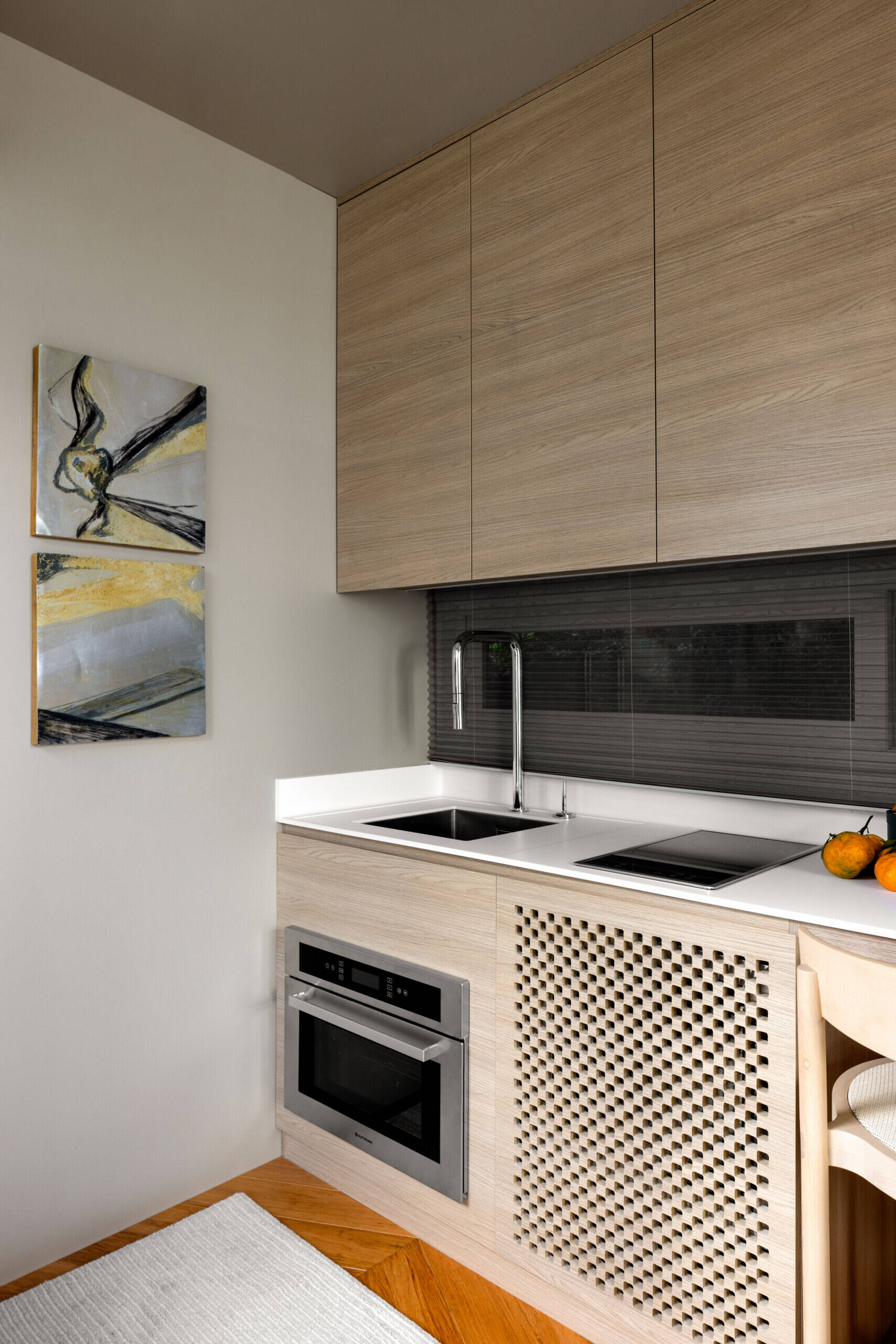 Inside this tiny house, every inch is intentional. Warm bamboo finishes, custom furniture, and smart tech create a calm, modern space that feels far bigger than its footprint. The open layout flows seamlessly between living, kitchen, and sleeping areas.