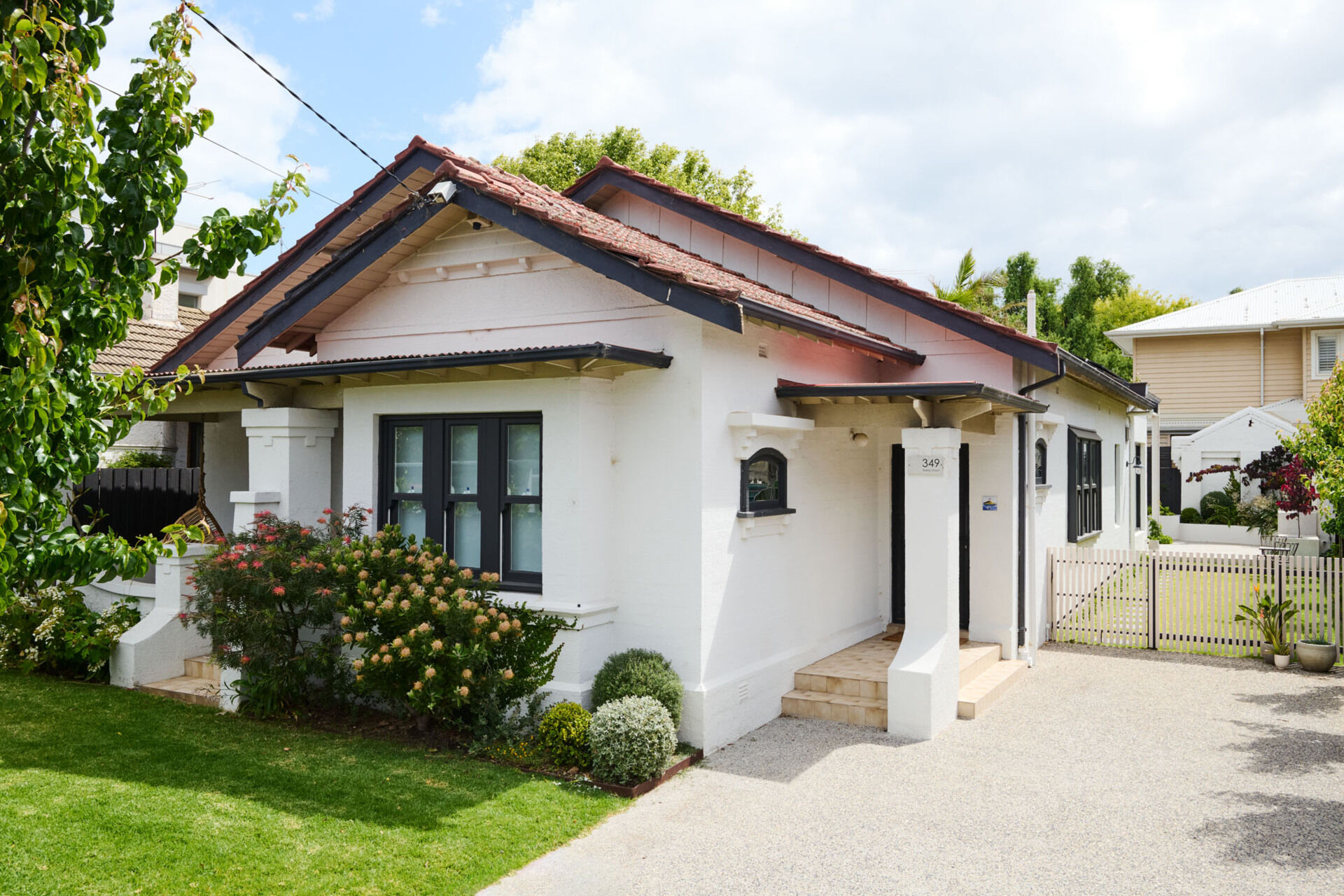 A serene family home in Elwood where heritage charm meets modern light-filled living. This sanctuary is all about natural textures, vaulted ceilings, and seamless garden connections.