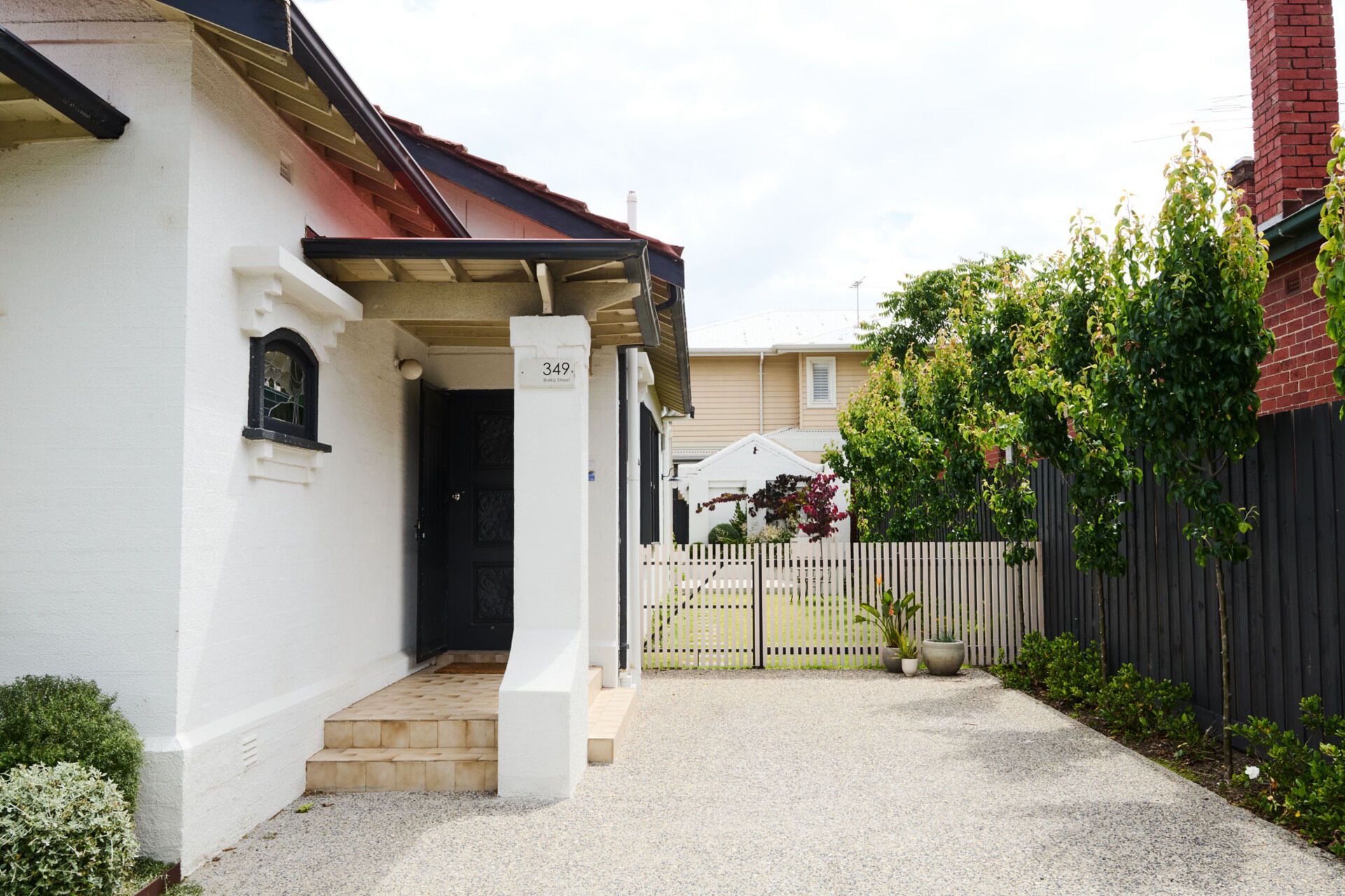 A serene family home in Elwood where heritage charm meets modern light-filled living. This sanctuary is all about natural textures, vaulted ceilings, and seamless garden connections.