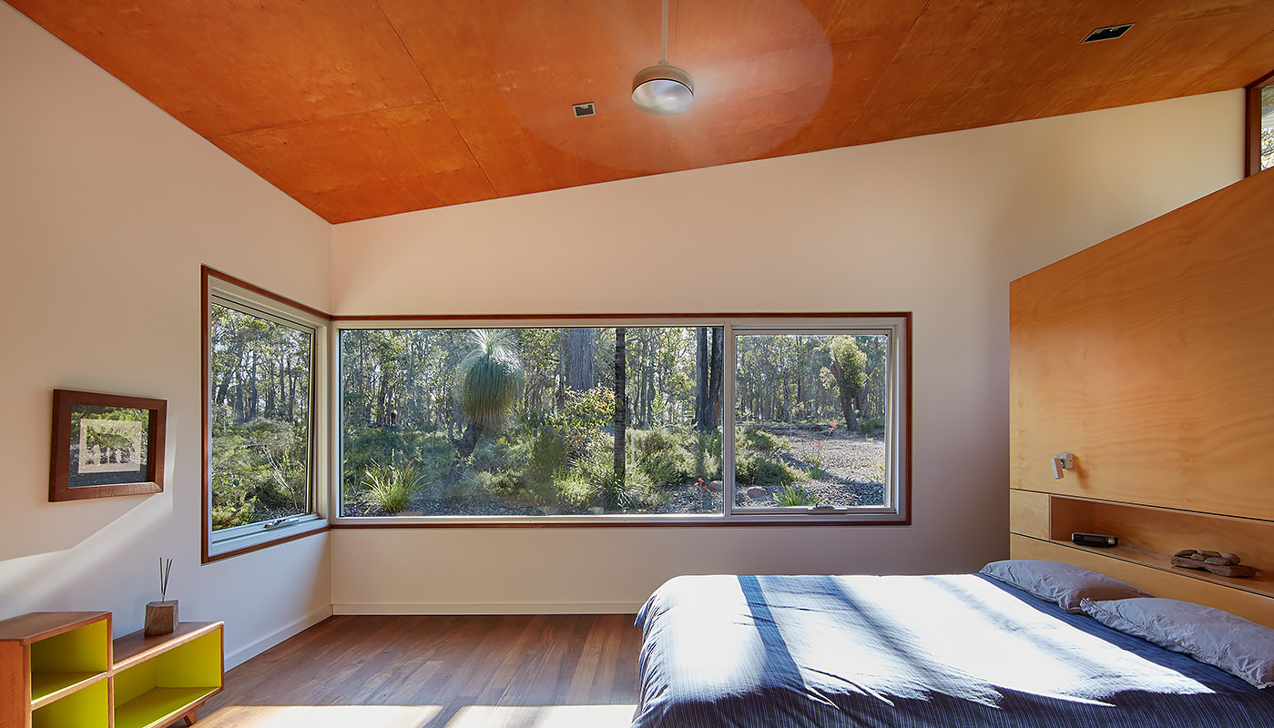 One of home's features is the use of corner windows that open the home to panoramic views of the bushland. These windows eliminate the typical sense of enclosure, creating the feeling of being surrounded by trees rather than separated from them.