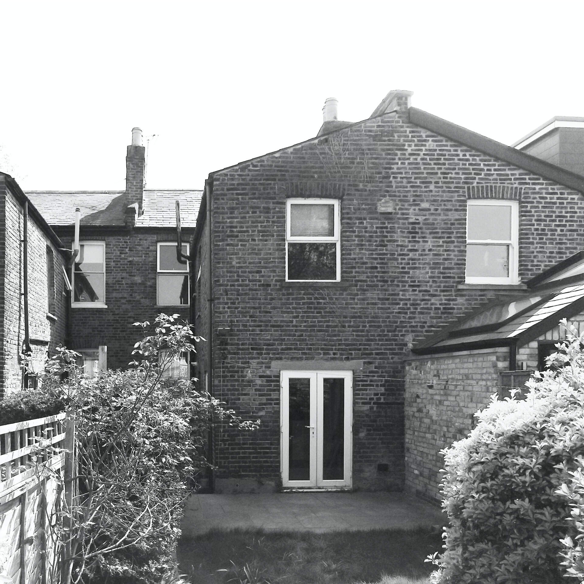 BEFORE - The original terrace had a narrow kitchen and disconnected rooms.