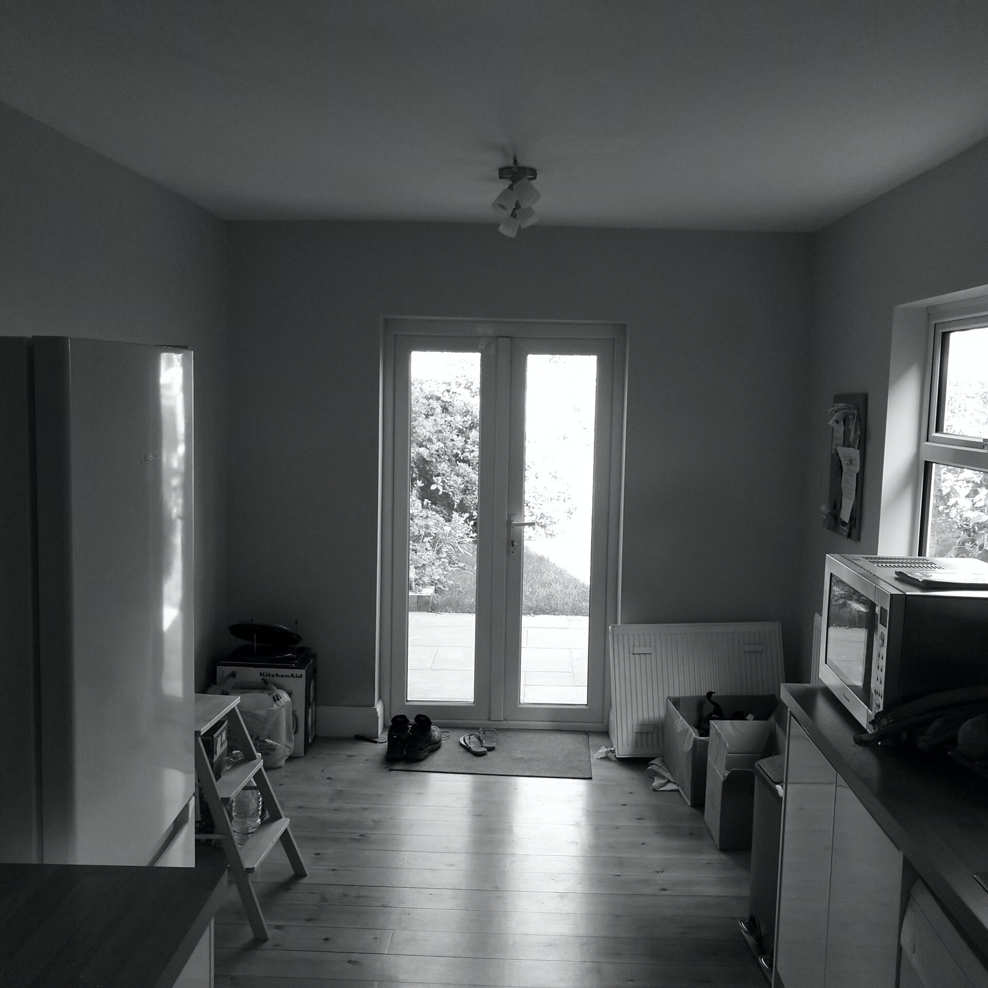 BEFORE - The original terrace had a narrow kitchen and disconnected rooms.