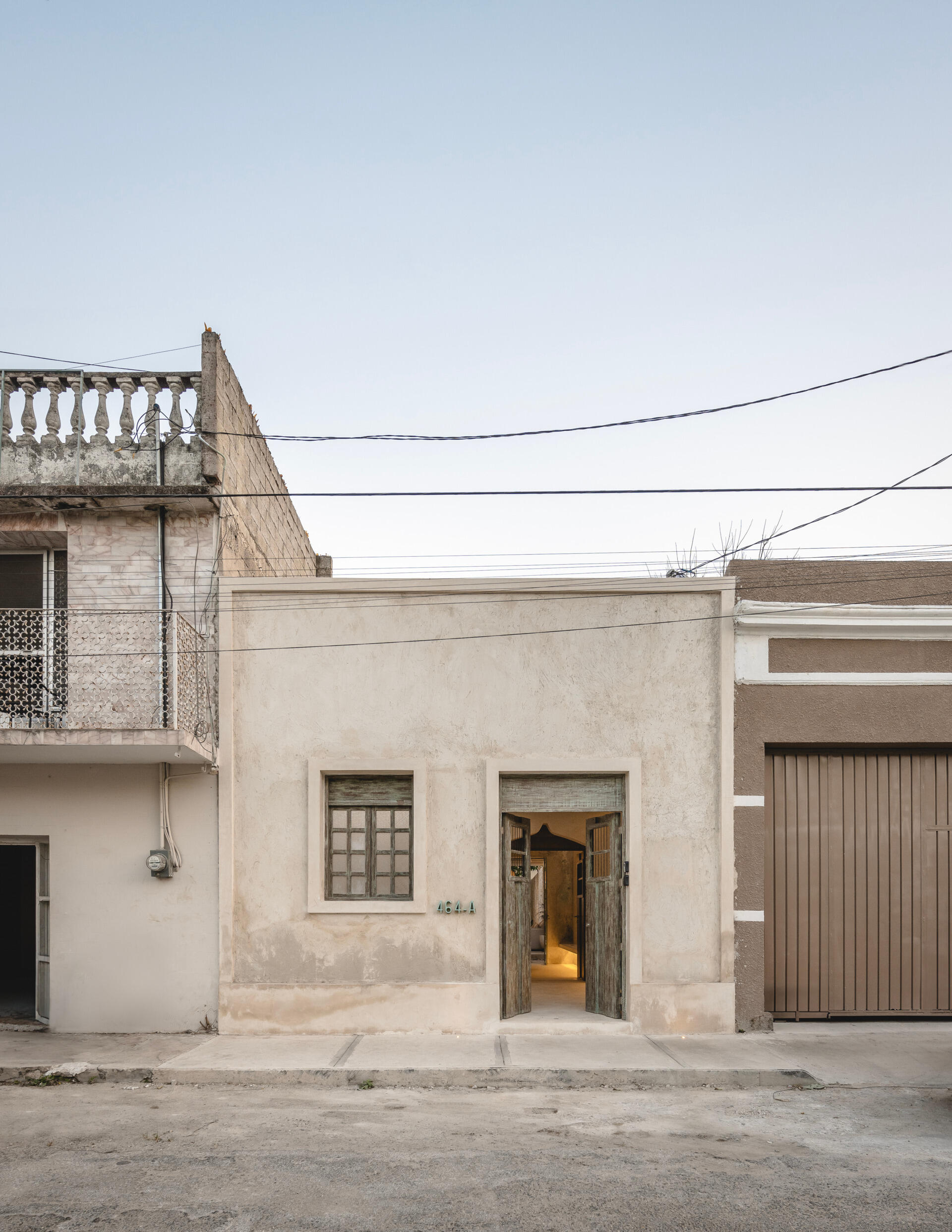 This renovated home sits on a narrow urban lot just five meters wide and over 30 meters long, and has six modules with three enclosed spaces and three open-air patios.