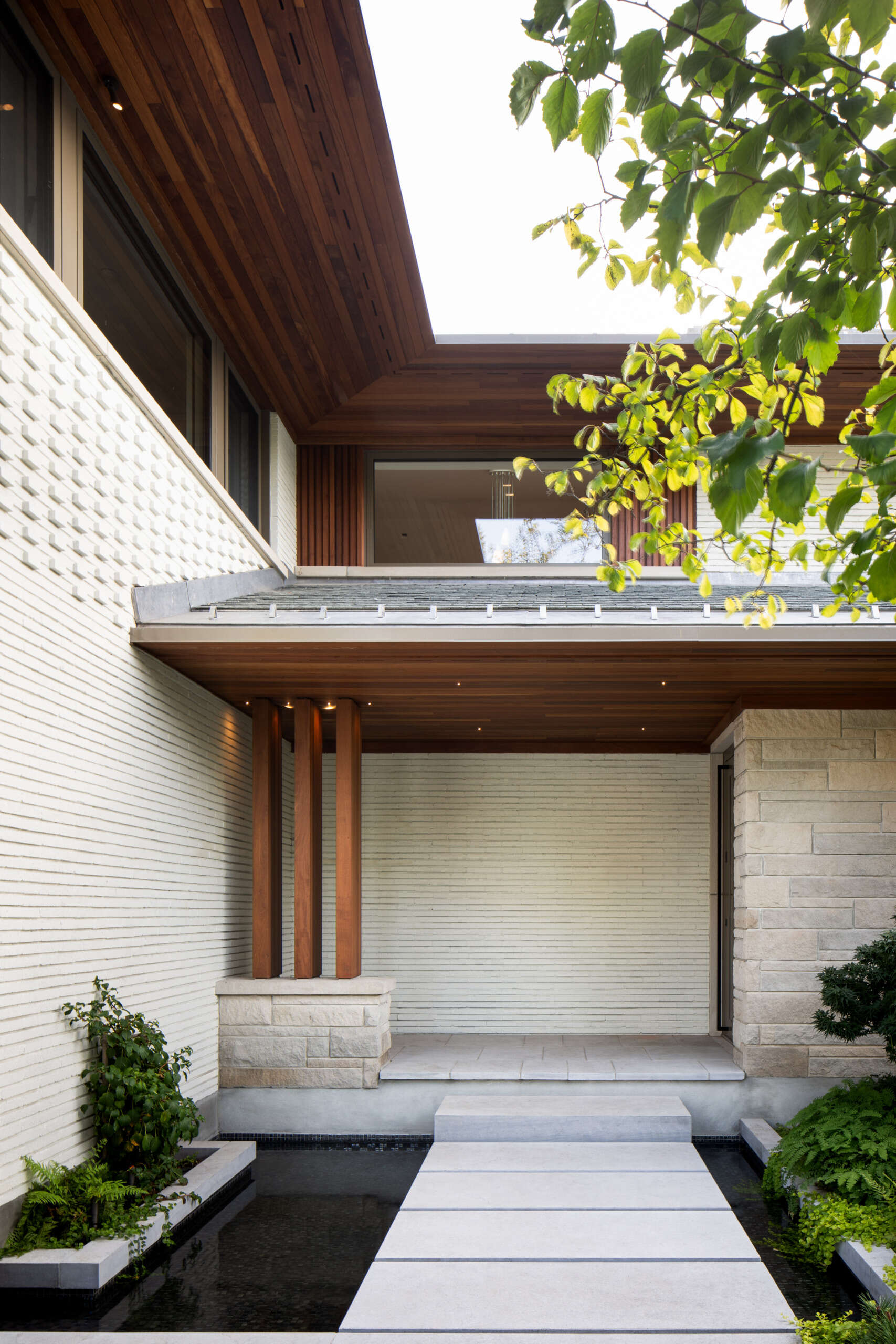 Nature plays a central role in the design of this home. A Japanese-influenced garden replaces traditional lawn with fragrant thyme and river pebbles. Carefully composed water features, including still ponds, a side courtyard fountain, and reflective basins, bring serenity and movement. The result is a meditative terrain that blurs the line between built and natural environments.