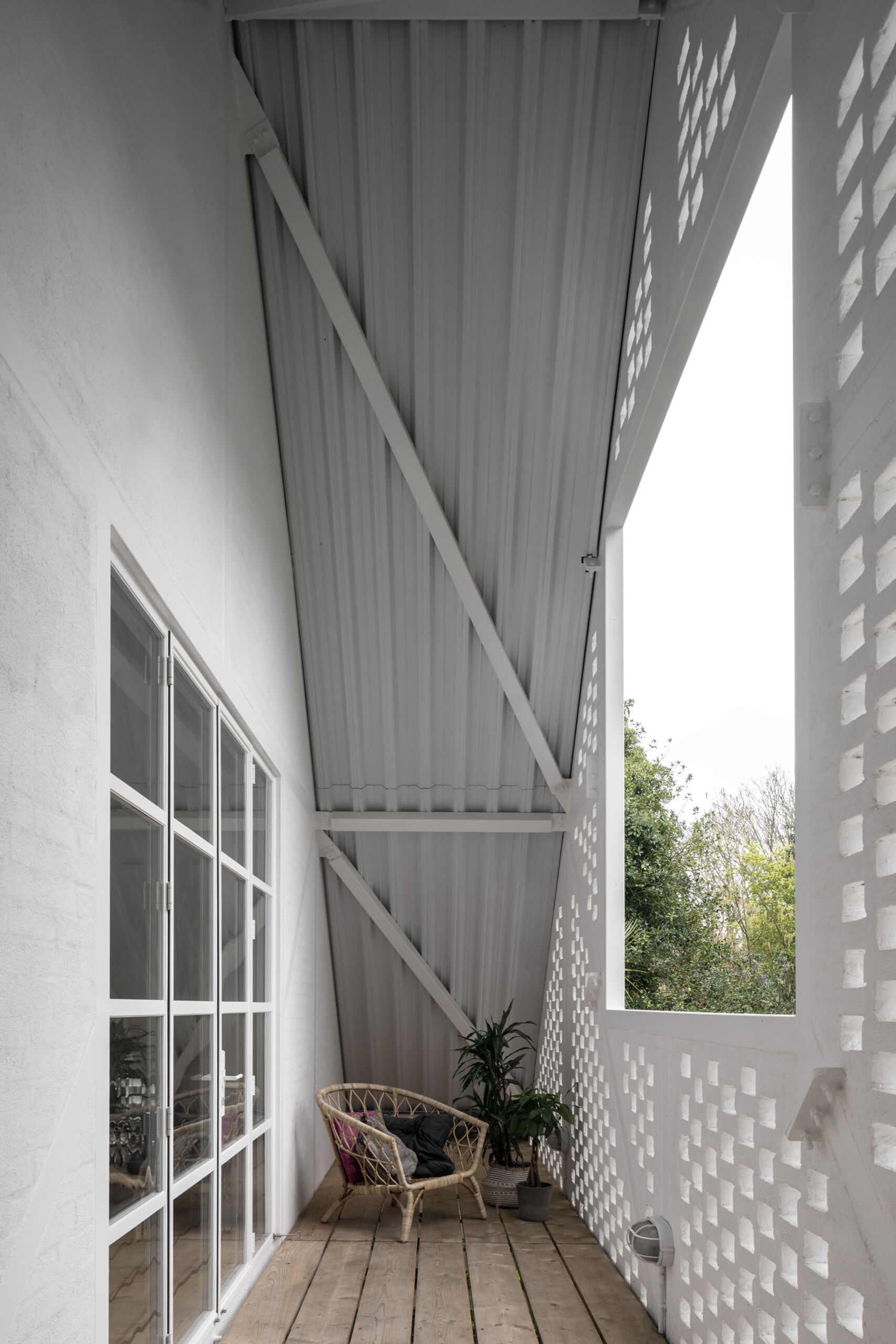 This private balcony off the main bedroom opens to treetop views, offering a quiet spot to watch the sky without ever leaving home.