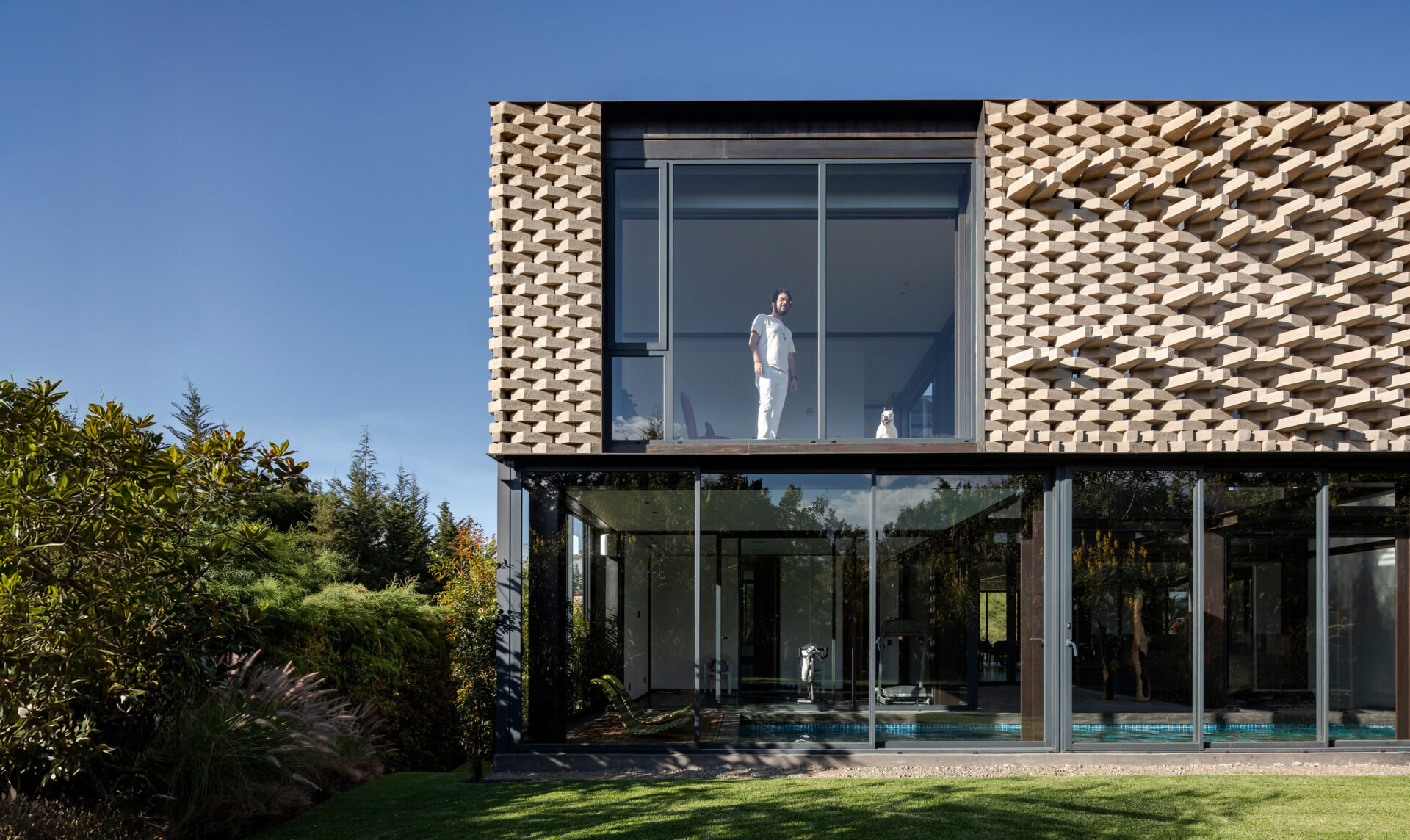 A modern home with a sculptural brick facade.