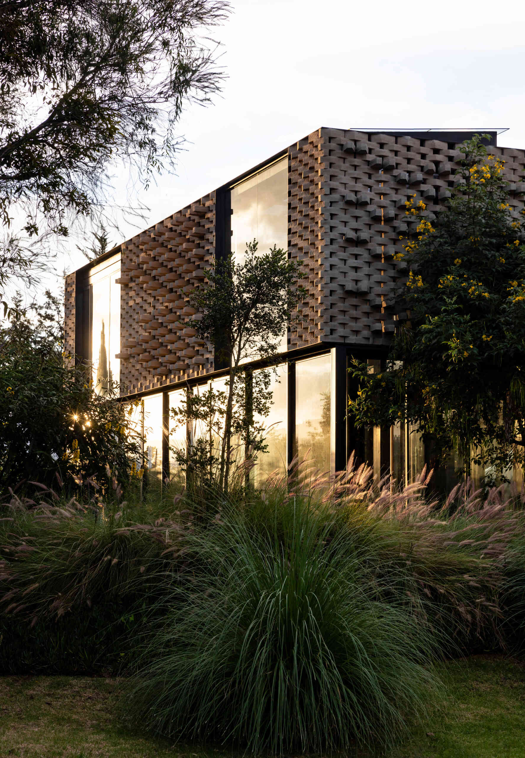 A modern home with a sculptural brick facade.