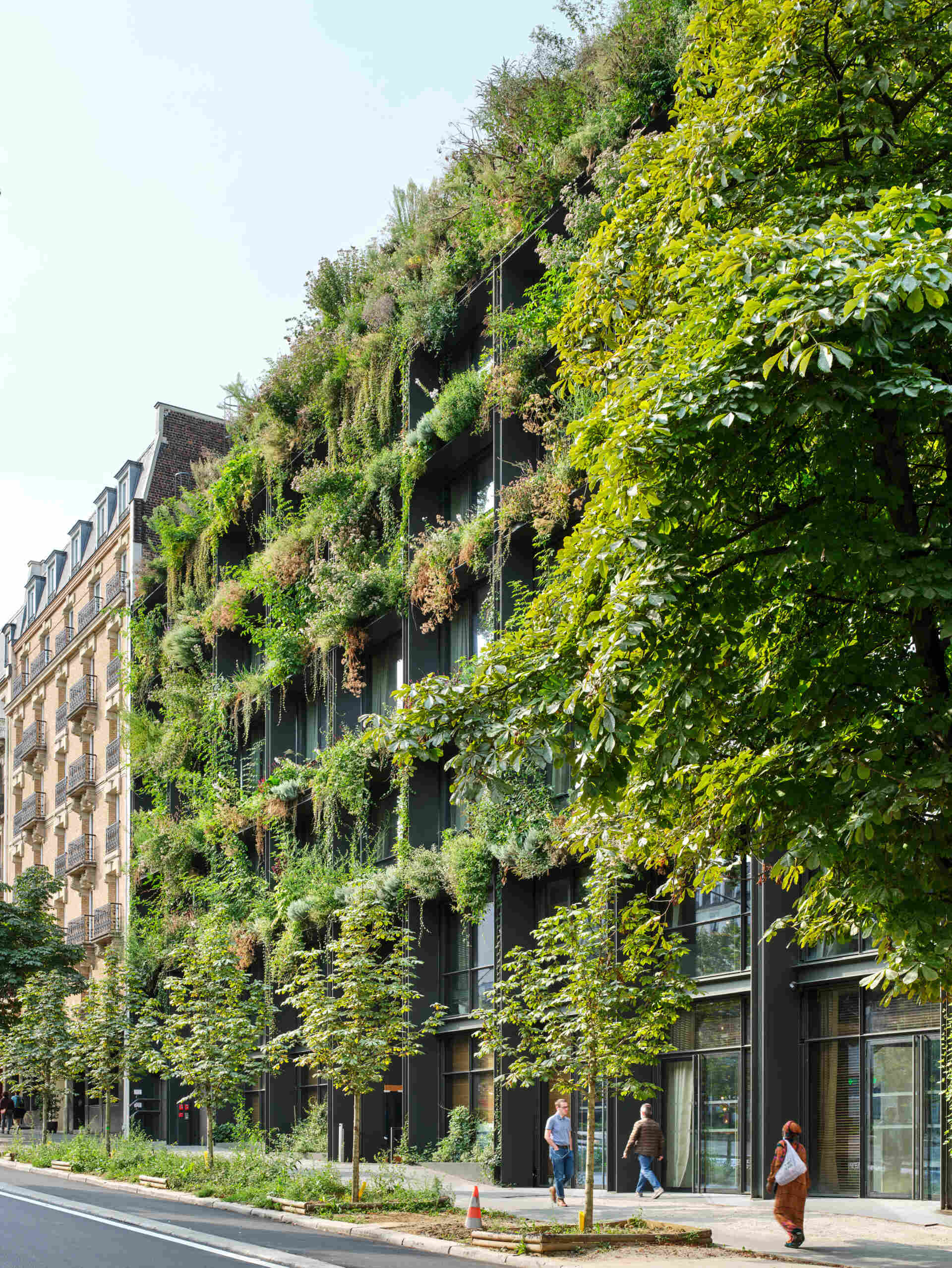 A striking vertical garden wraps the entire façade of Villa M in Paris, transforming the building into a living, breathing ecosystem. Designed as an exoskeleton of greenery, it blends architecture and nature in a bold vision for urban sustainability.