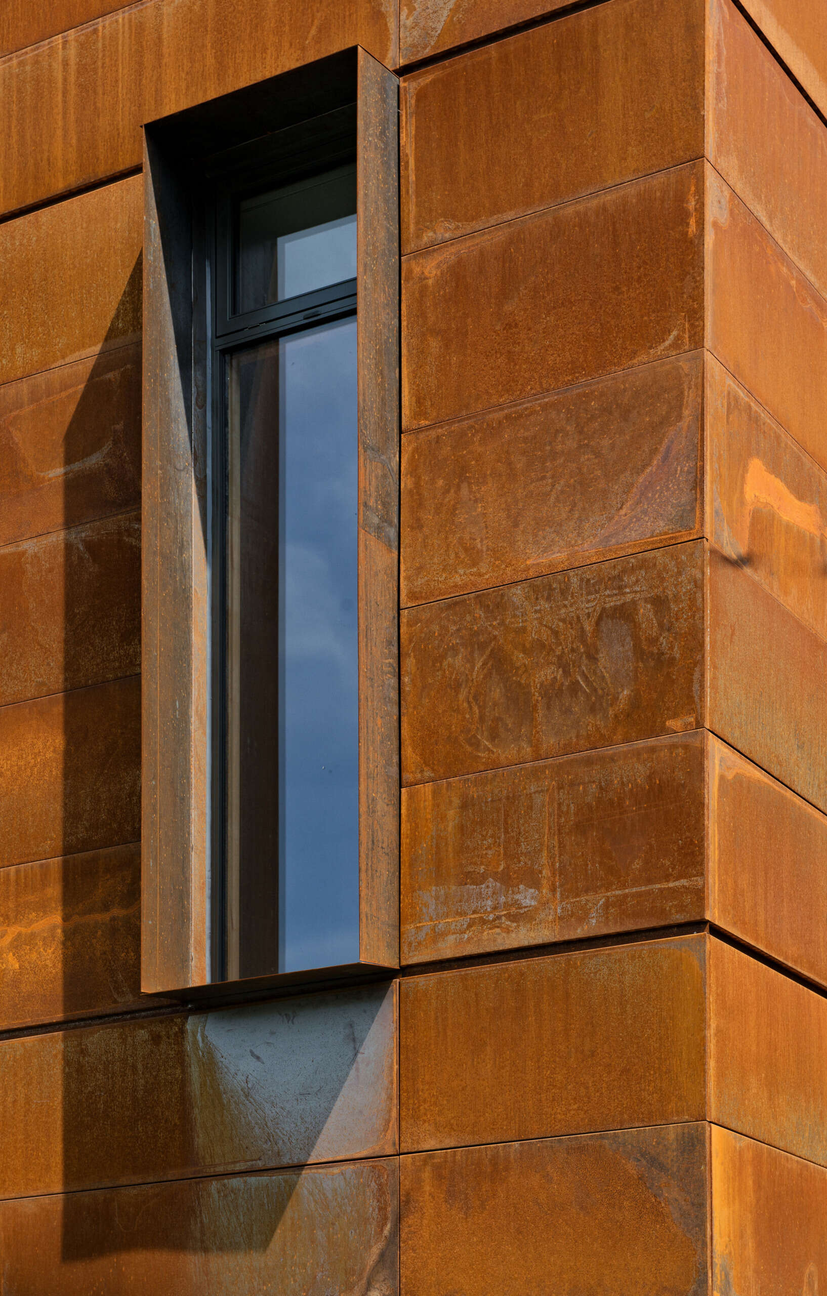 A striking corten steel facade gives this Toronto home a sculptural, textural presence while blending seamlessly into its urban setting. Designed by Tact Design, it sets the tone for the home's bold yet elegant aesthetic.