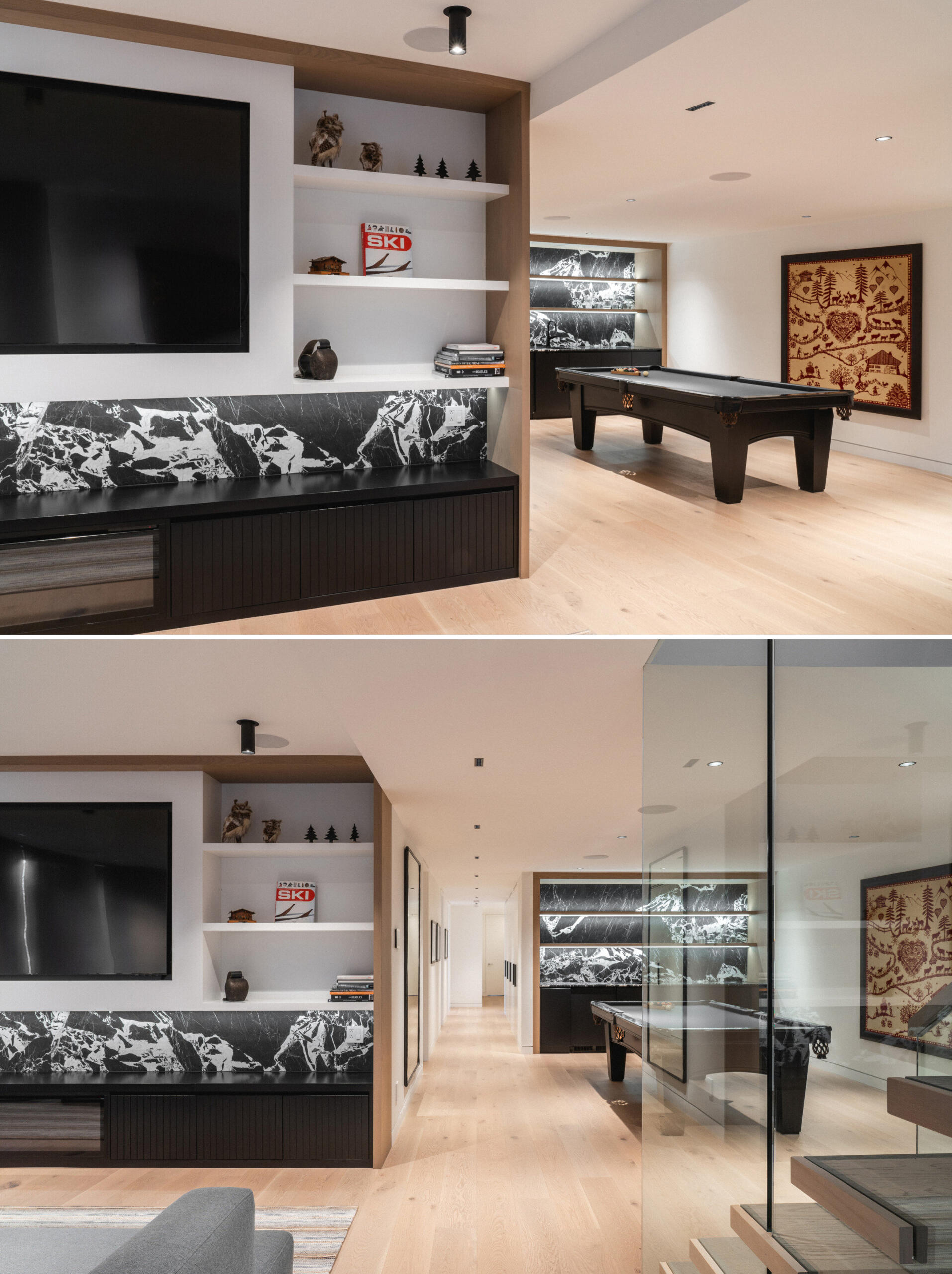 On the lower level of this modern house, a spacious lounge connects to a game room outfitted with a pool table and bar. These spaces encourage relaxed gathering and extend the home’s function beyond seasonal retreat.