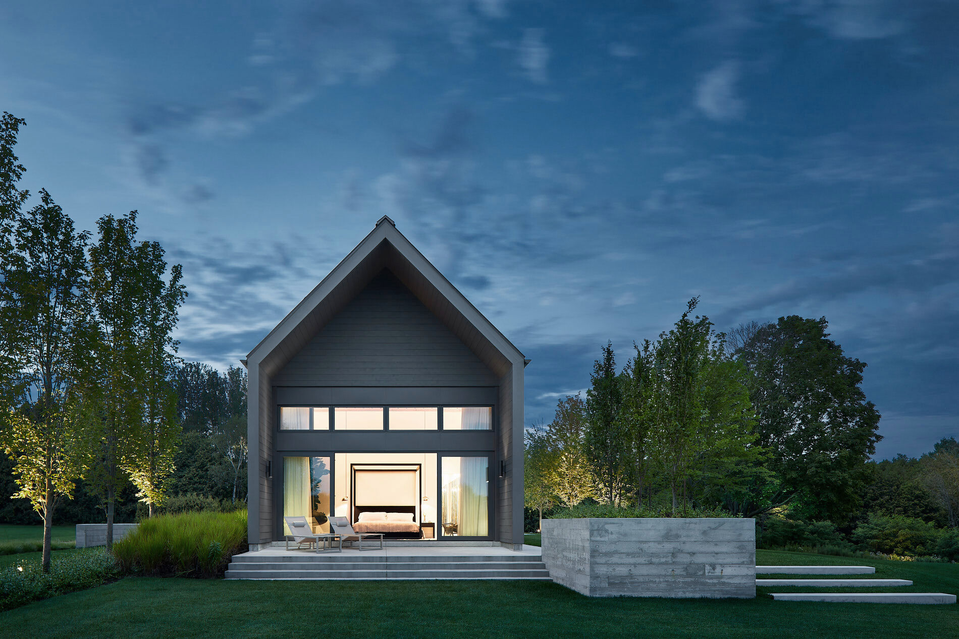 This primary bedroom becomes a peaceful escape, complete with its own private patio and a connection to the outdoors.