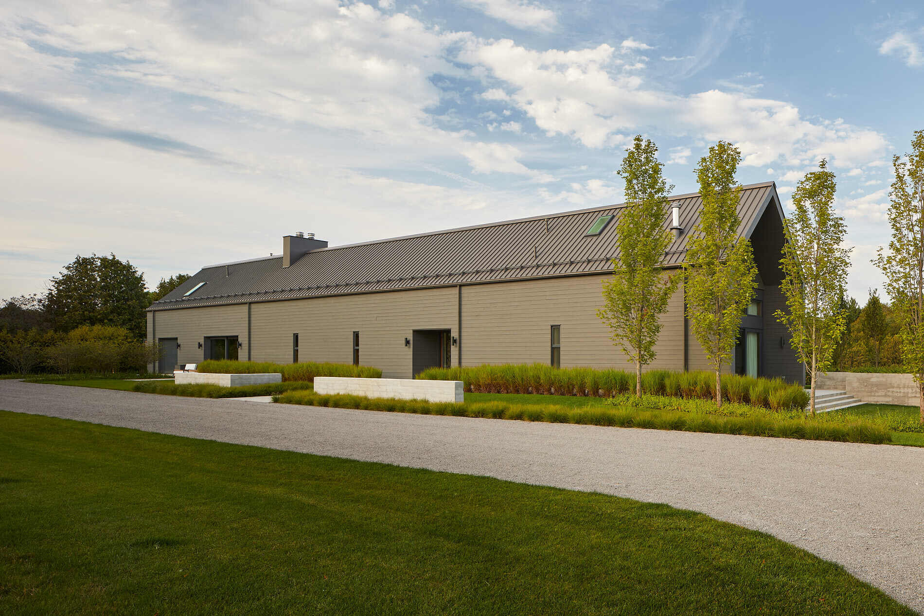 Explore the longhouse-inspired architecture of this Ontario farmhouse, where charcoal-stained cedar and east-facing design bring the landscape into focus.