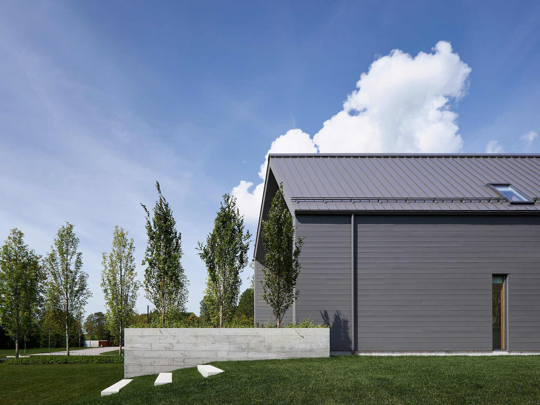 Explore the longhouse-inspired architecture of this Ontario farmhouse, where charcoal-stained cedar and east-facing design bring the landscape into focus.