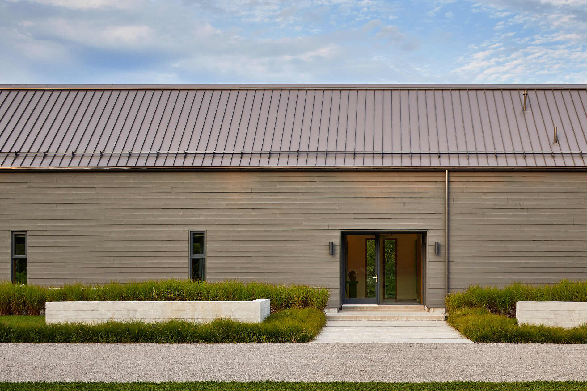 Explore the longhouse-inspired architecture of this Ontario farmhouse, where charcoal-stained cedar and east-facing design bring the landscape into focus.