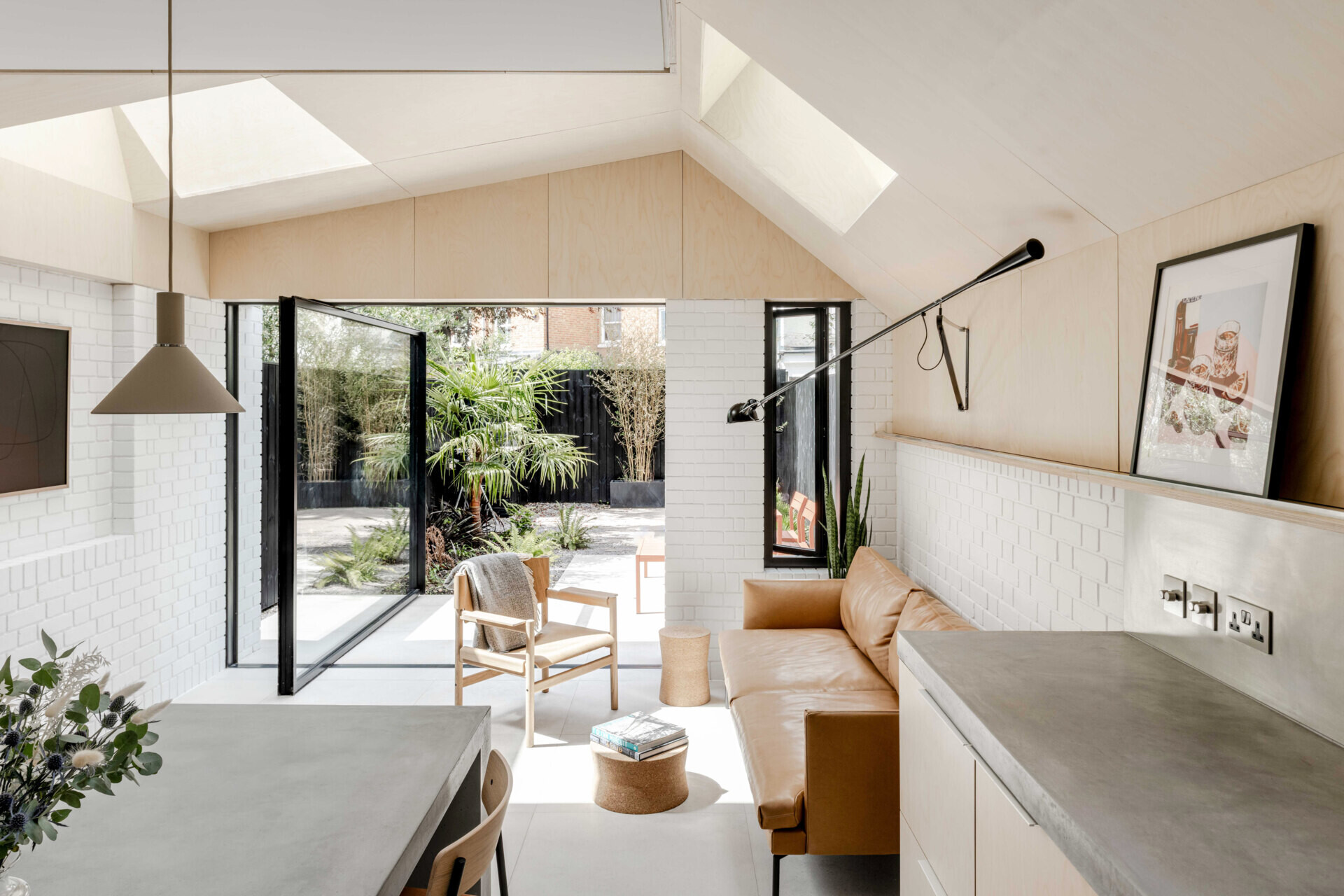The open-plan living zone feels light and grounded, with soft materials and smart detailing that elevate everyday moments.