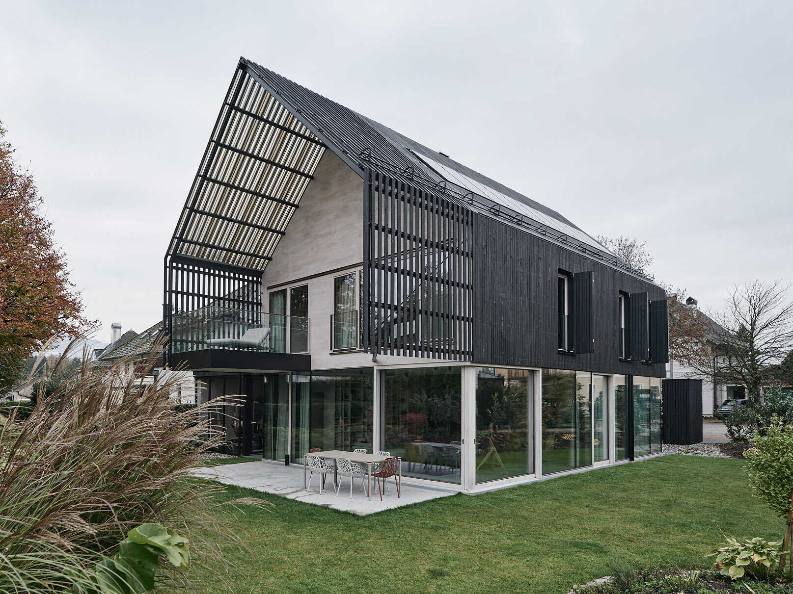 A modern gabled form wrapped in pre-weathered timber, Casa S blends tradition with a floating, sculptural silhouette.