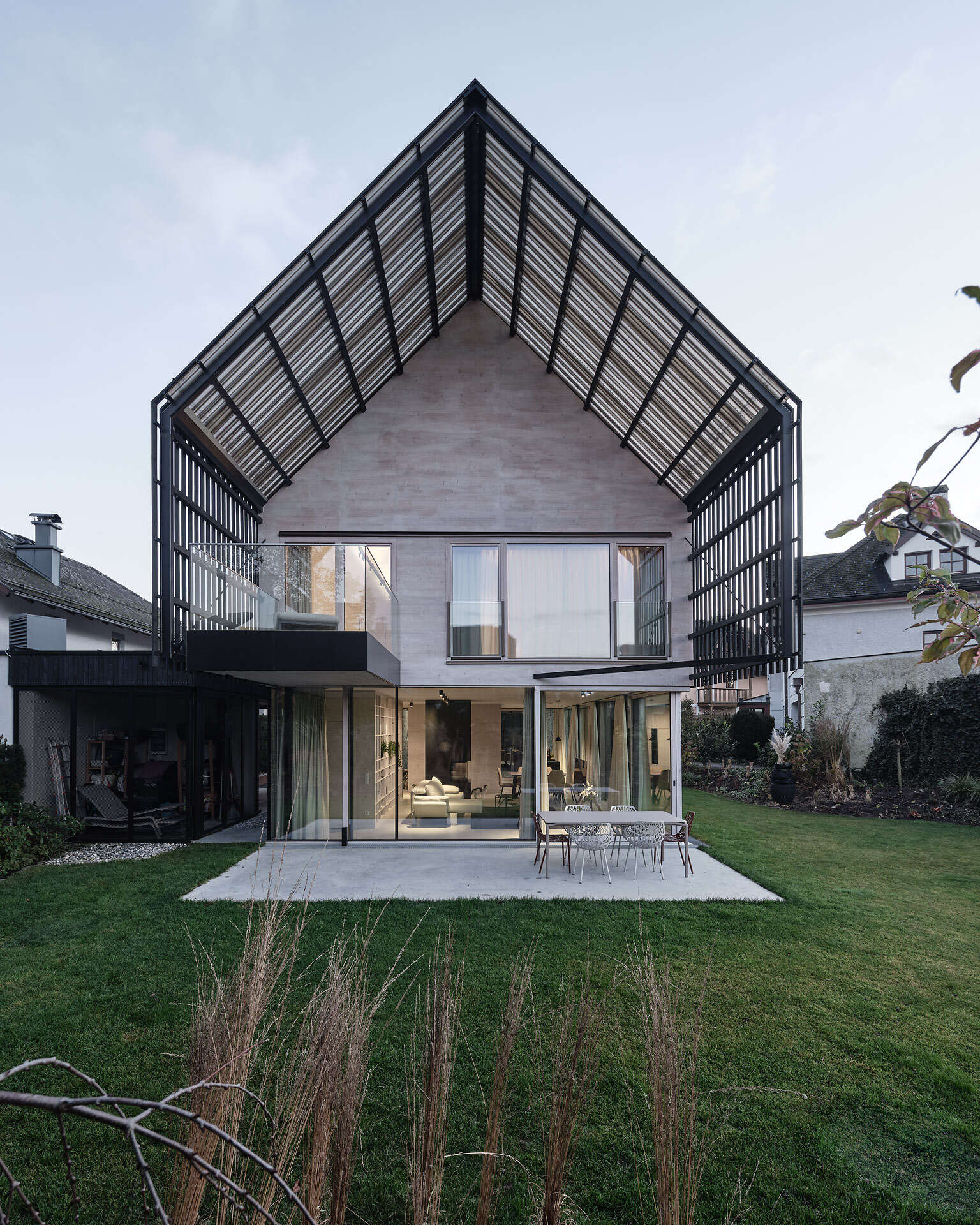 A modern gabled form wrapped in pre-weathered timber, Casa S blends tradition with a floating, sculptural silhouette.