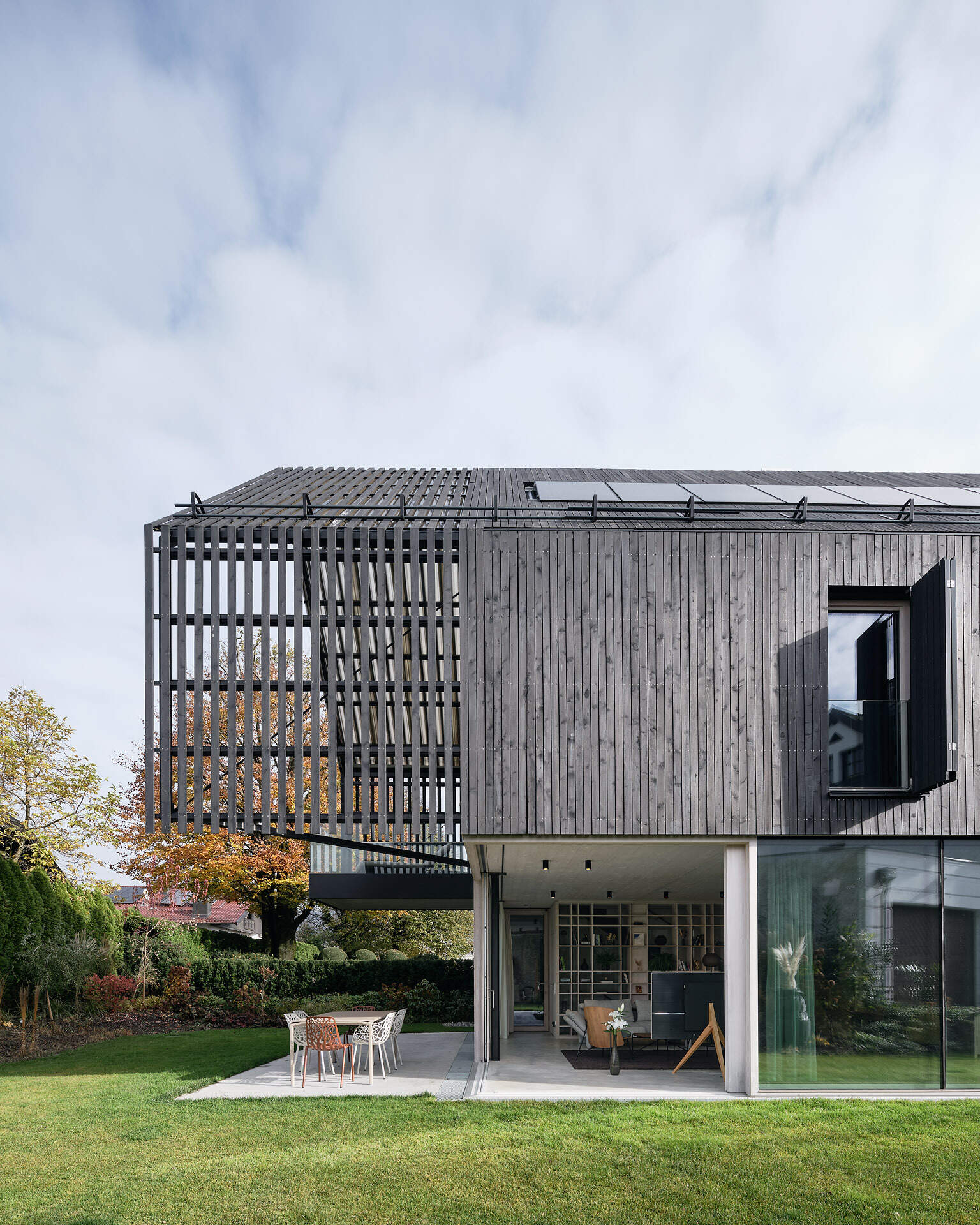 A modern gabled form wrapped in pre-weathered timber, Casa S blends tradition with a floating, sculptural silhouette.