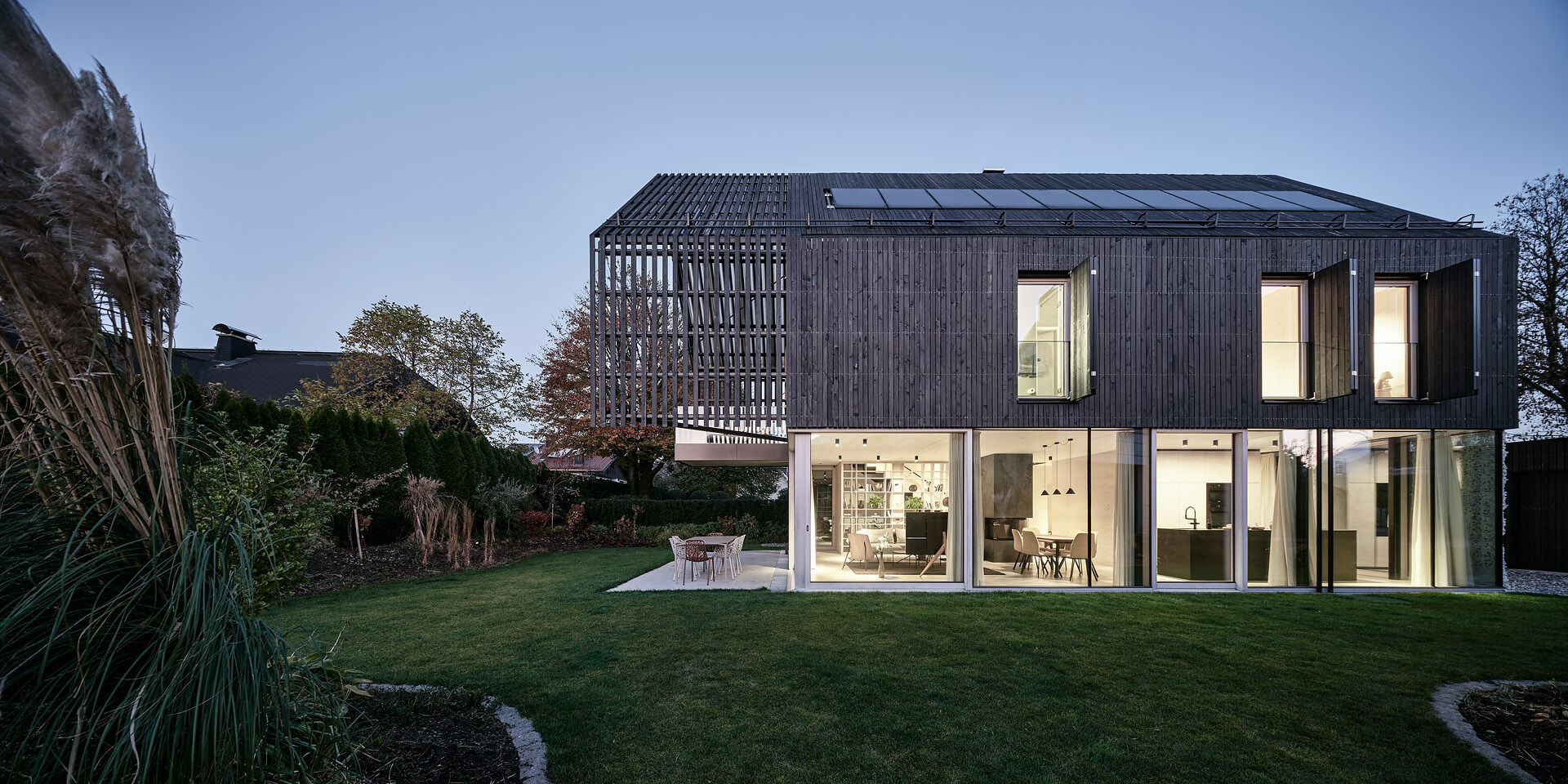 A modern gabled form wrapped in pre-weathered timber, Casa S blends tradition with a floating, sculptural silhouette.