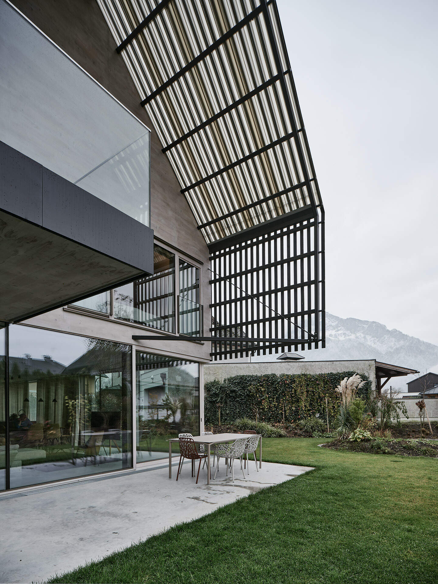 A modern gabled form wrapped in pre-weathered timber, Casa S blends tradition with a floating, sculptural silhouette.