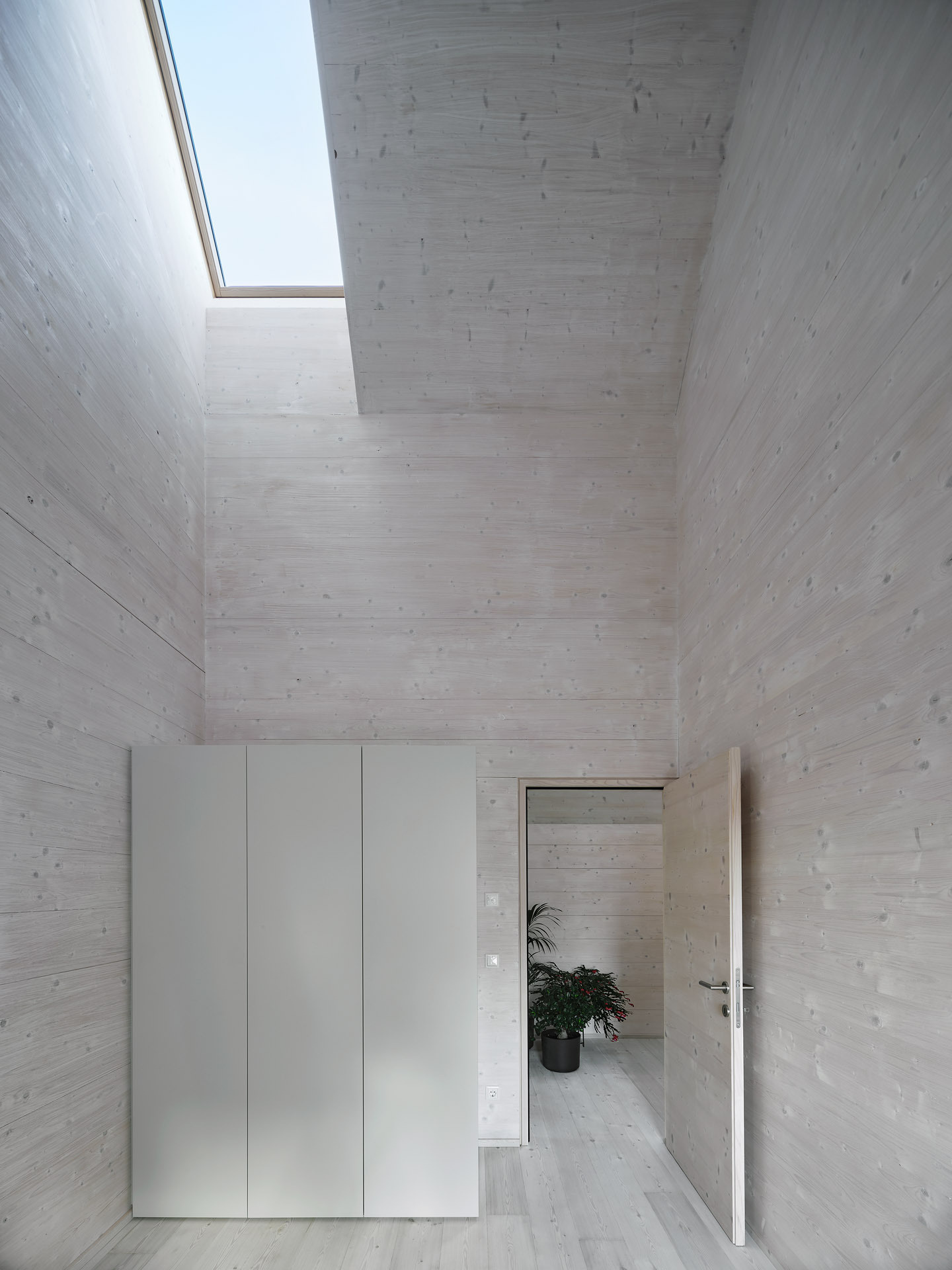 Private and peaceful, the upper-level bedrooms are tucked behind folding timber shutters, with a skylight framing the sky.