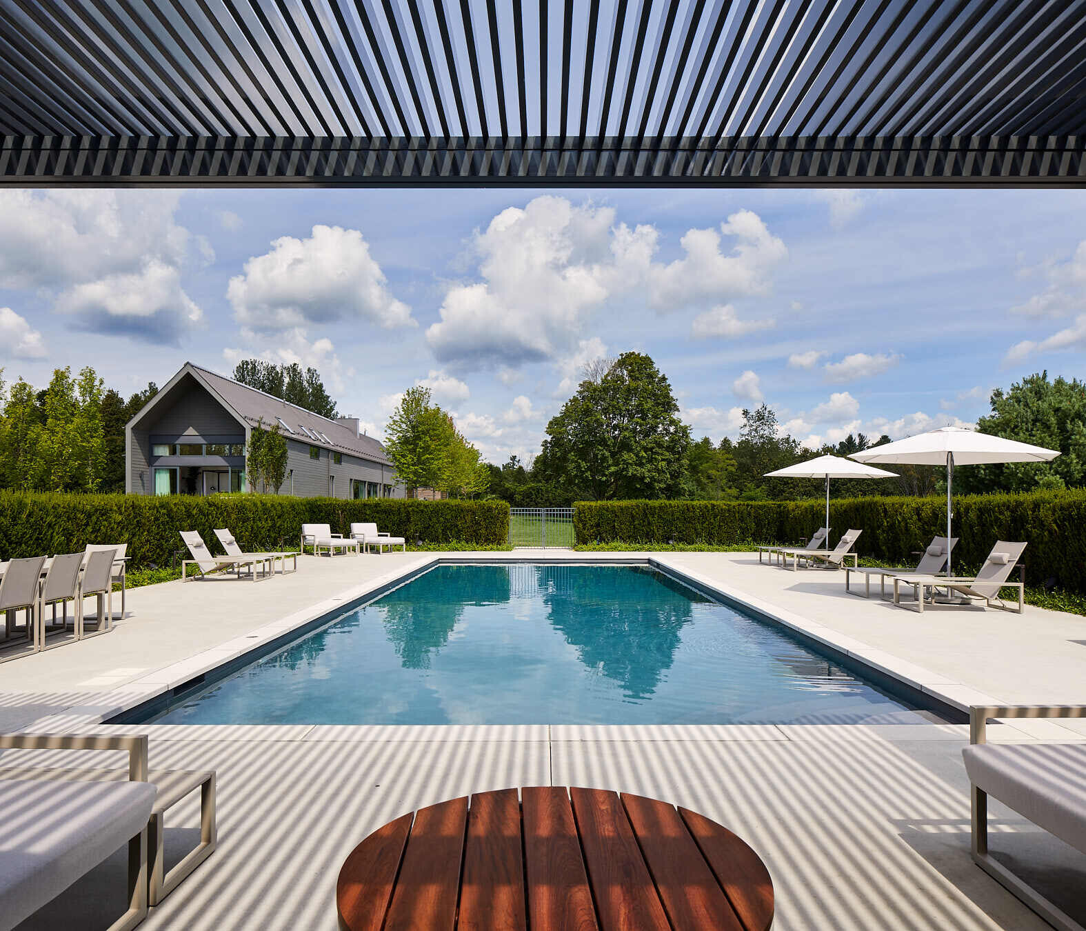 A pool and guest house sit alongside a charming cabana, ideal for slow summer days and starry nights.