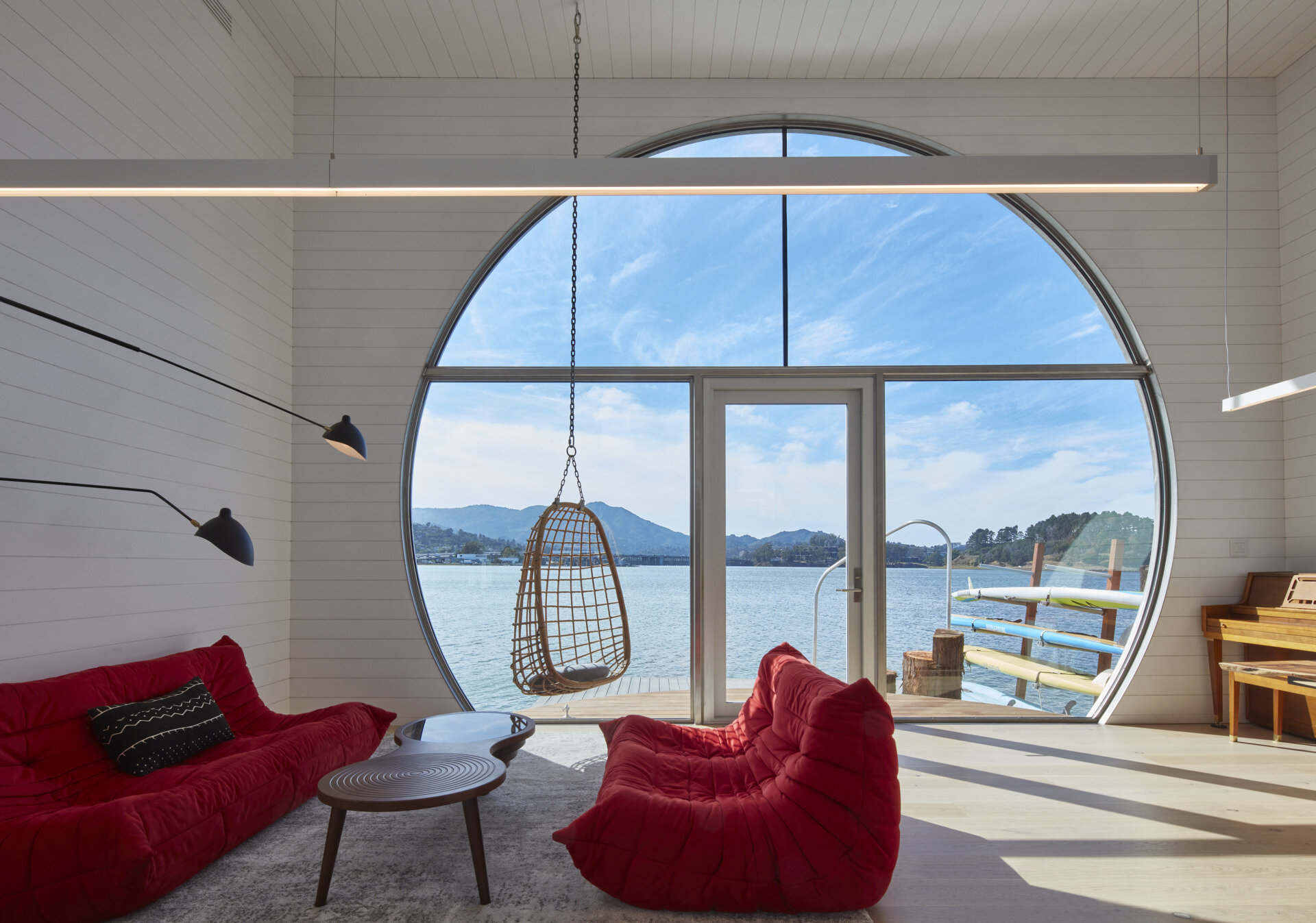 Bright and open, the living and kitchen areas of this houseboat blend seamless functionality with natural light. The efficient layout maximizes space without sacrificing comfort, creating a warm and inviting heart of the home that celebrates life on the water.