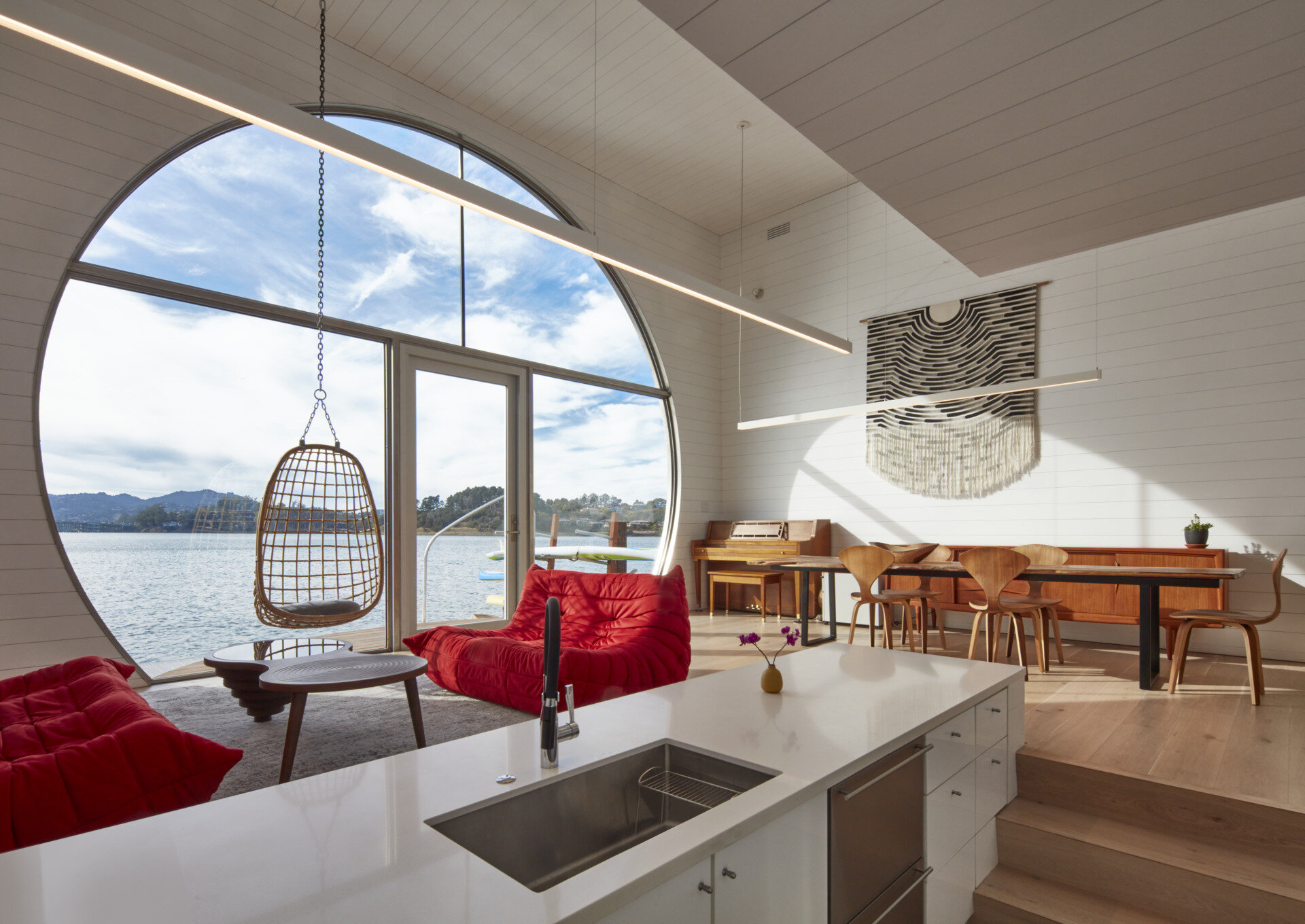 Bright and open, the living and kitchen areas of this houseboat blend seamless functionality with natural light. The efficient layout maximizes space without sacrificing comfort, creating a warm and inviting heart of the home that celebrates life on the water.