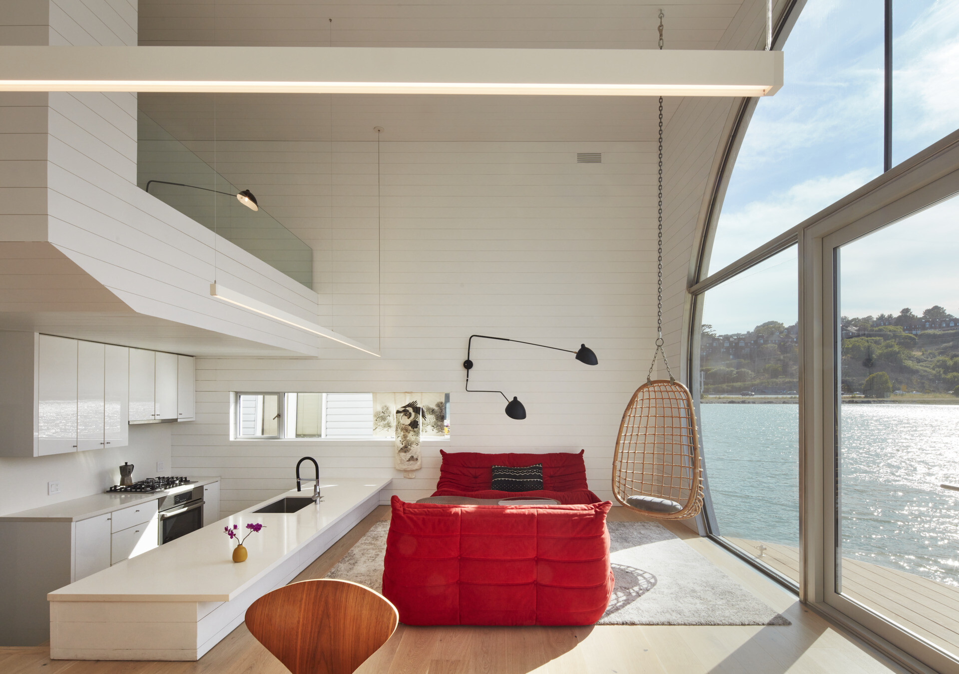 Bright and open, the living and kitchen areas of this houseboat blend seamless functionality with natural light. The efficient layout maximizes space without sacrificing comfort, creating a warm and inviting heart of the home that celebrates life on the water.
