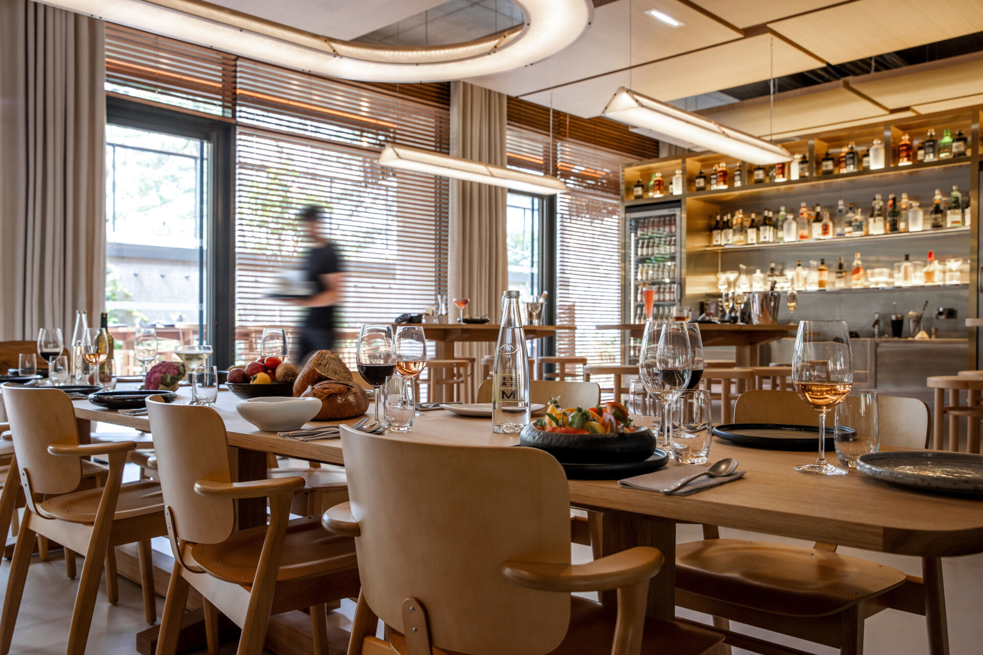 Inside Villa M, soft tones, natural materials, and Philippe Starck’s thoughtful design create calming, wellness-driven spaces. From restful hotel rooms to light-filled lounges and coworking areas, every detail invites comfort and connection.