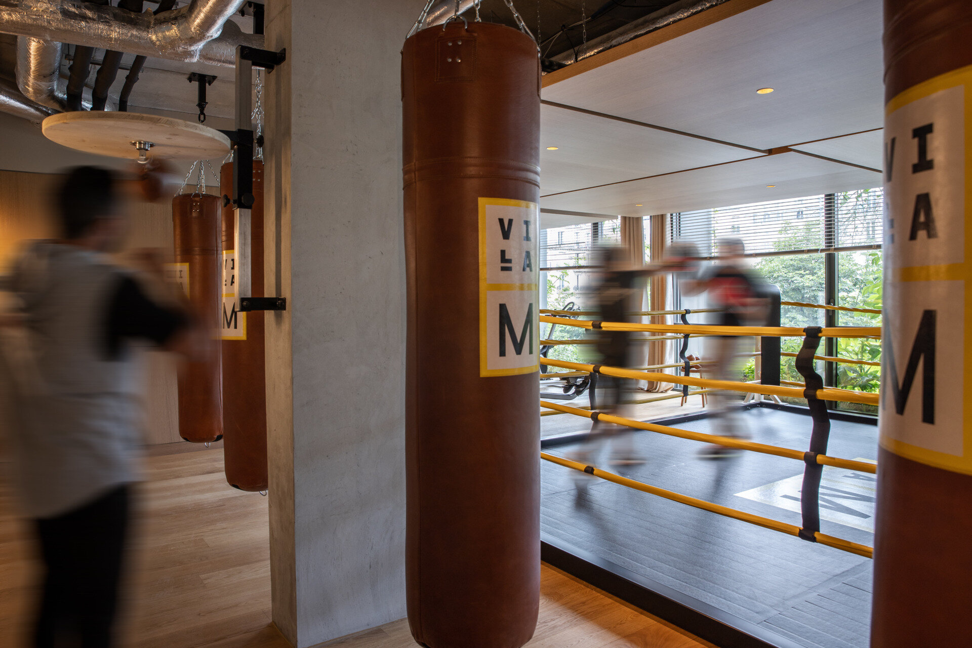 Inside Villa M, soft tones, natural materials, and Philippe Starck’s thoughtful design create calming, wellness-driven spaces. From restful hotel rooms to light-filled lounges and coworking areas, every detail invites comfort and connection.