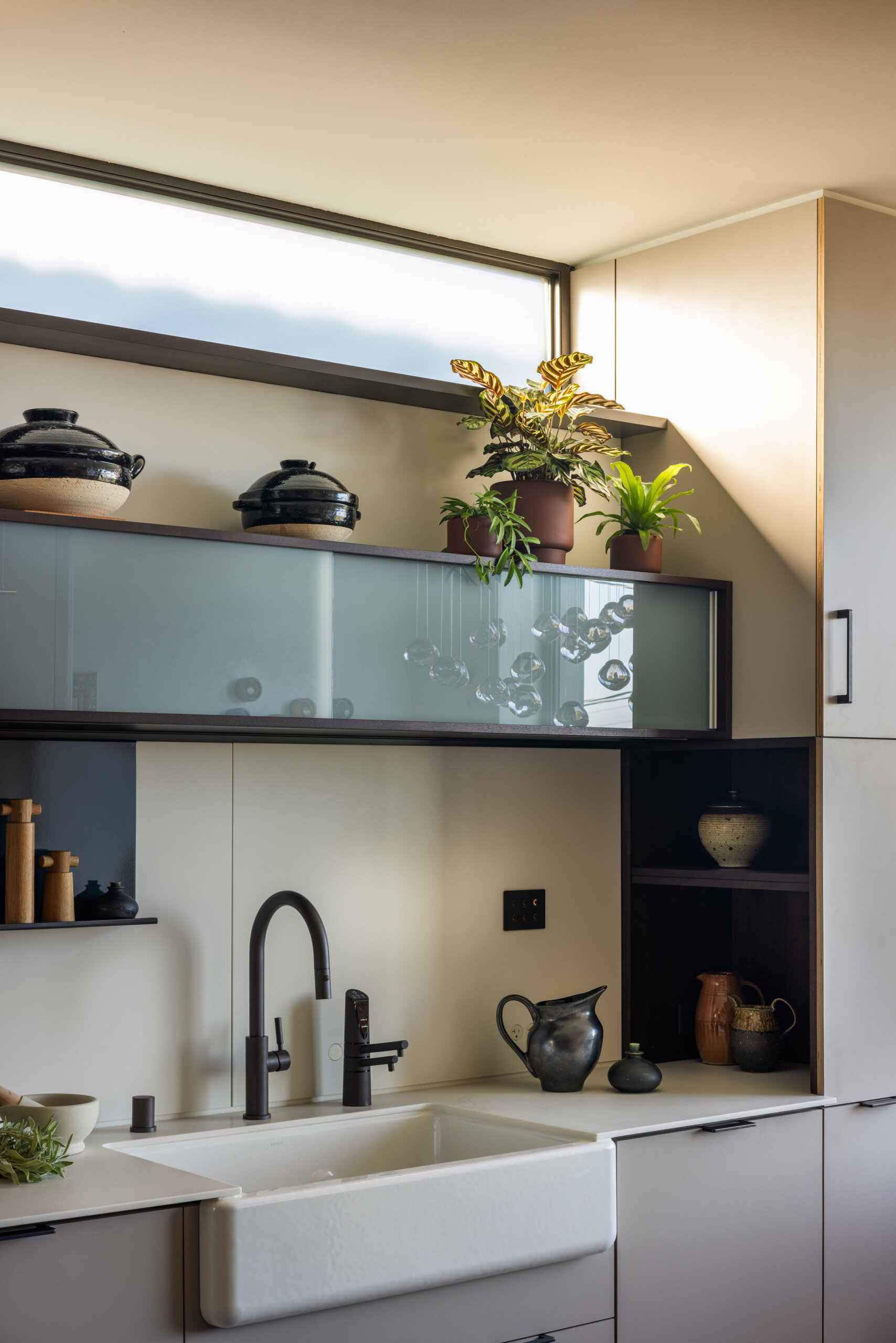 Designed by Henrybuilt, this kitchen is the true heart of the home. Its materials and layout reflect both beauty and utility, a space built for entertaining and everyday living alike. The kitchen island in particular serves as a multi-functional hub, from food prep to homework sessions.