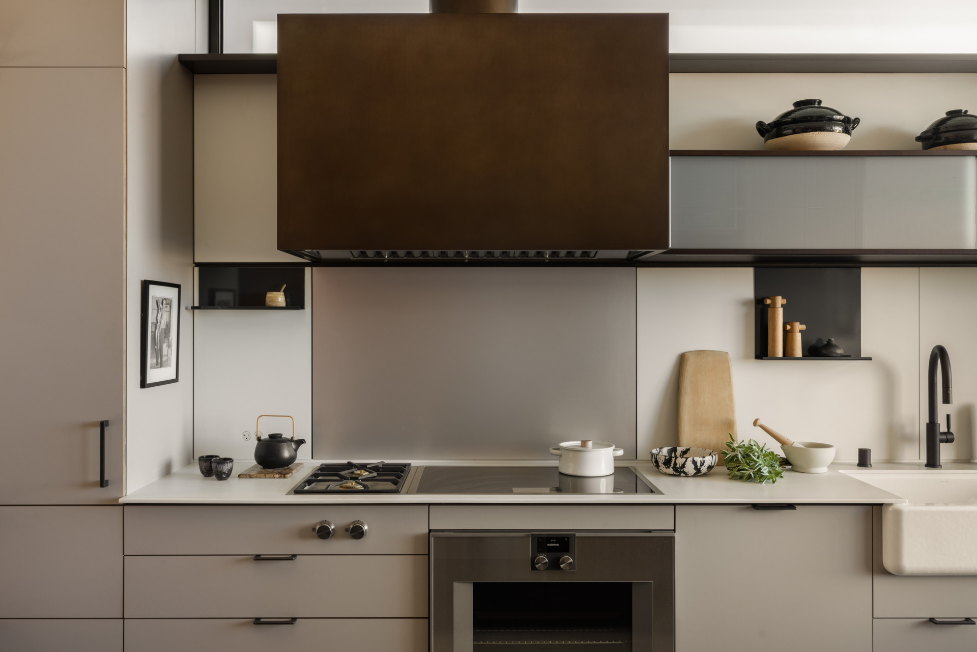 Designed by Henrybuilt, this kitchen is the true heart of the home. Its materials and layout reflect both beauty and utility, a space built for entertaining and everyday living alike. The kitchen island in particular serves as a multi-functional hub, from food prep to homework sessions.
