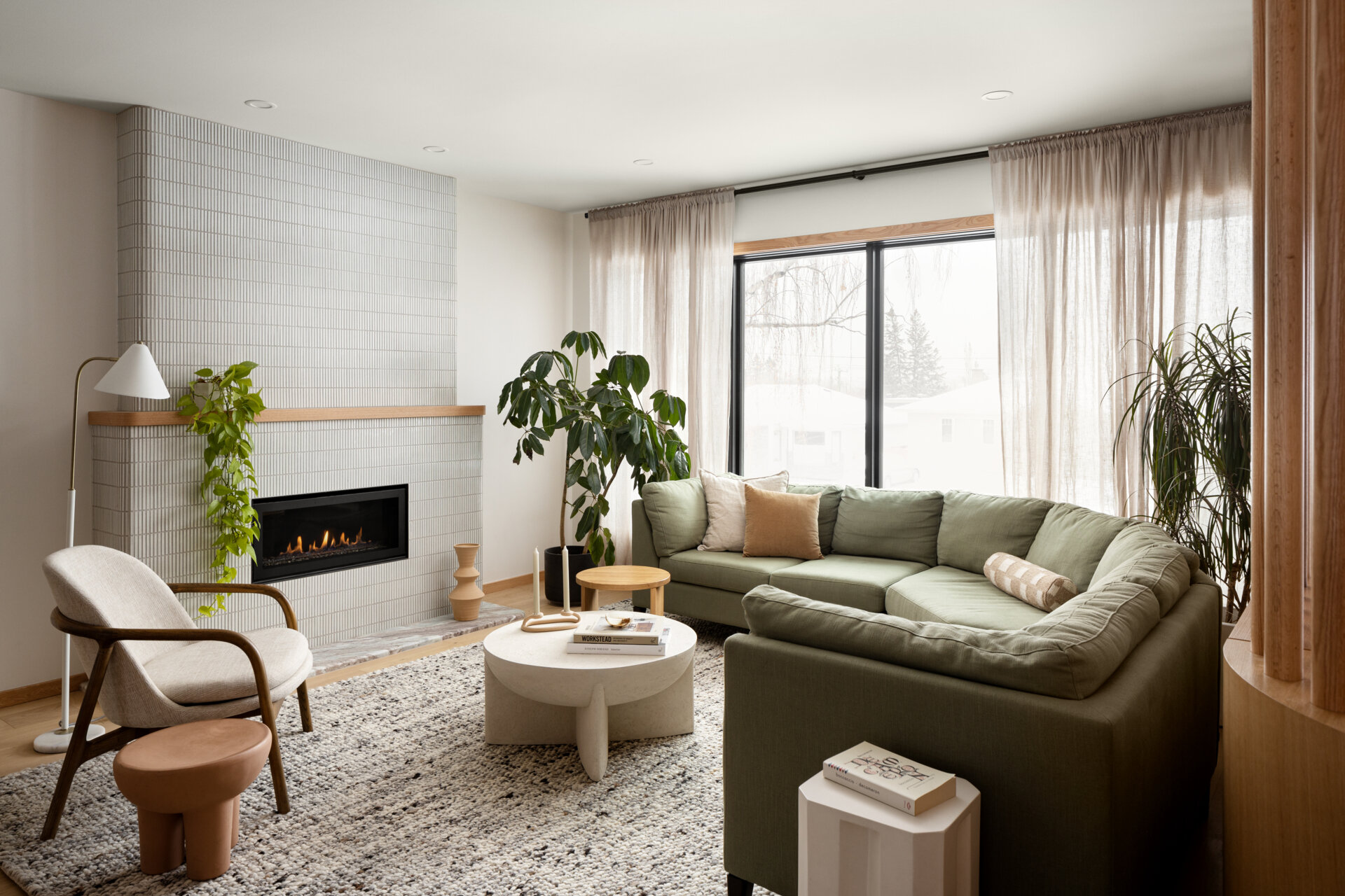 From the entry, the home opens into a relaxed, multi-functional family room. While not overly detailed in the original layout, this space acts as a flexible core, likely embracing the same soft edges and earthy tones found throughout. With storage as a priority, built-ins and cozy seating likely create areas for connection and ease.