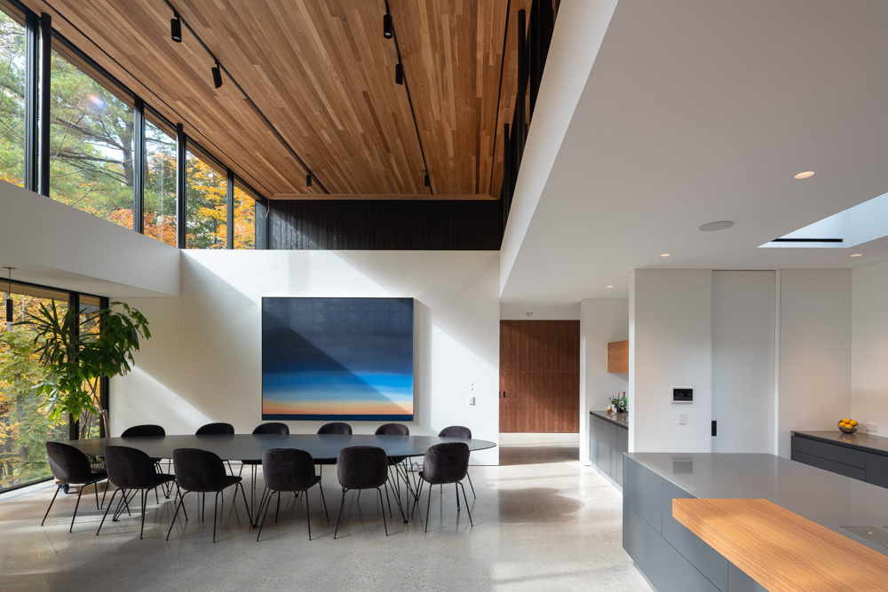 The dining space sits at the heart of the home, open and effortlessly connected to kitchen and living.