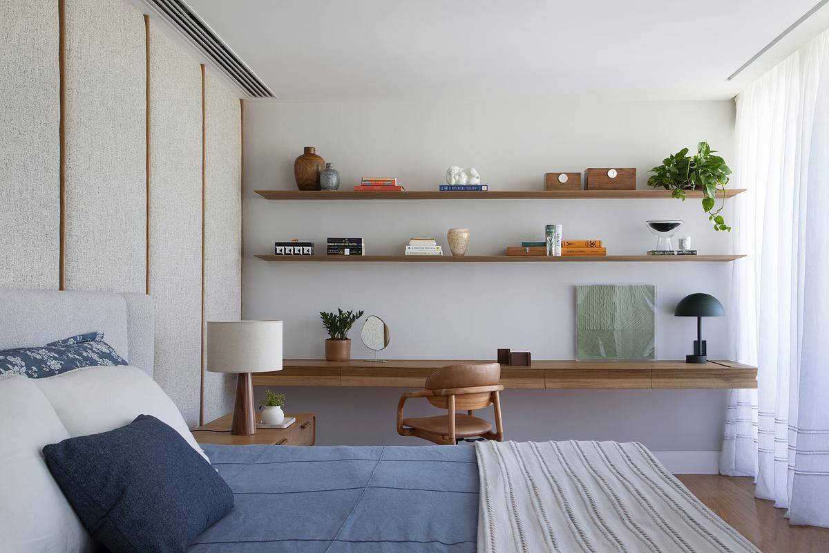 The couple’s suite combines natural wood, soft textures, and minimalist cabinetry to create a restful, personalized retreat with tailored storage.