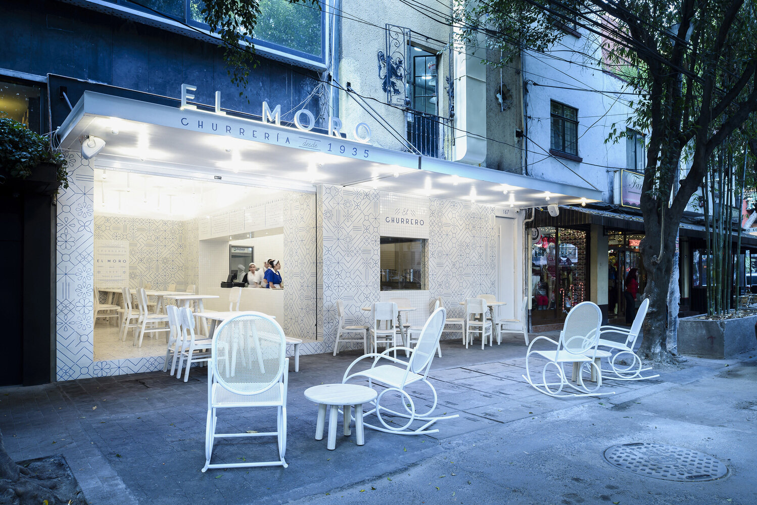 Step inside EL MORO, a historic Mexico City café reimagined with playful blue-and-white tilework, Art Deco touches, and a minimalist palette inspired by sugar and tradition.