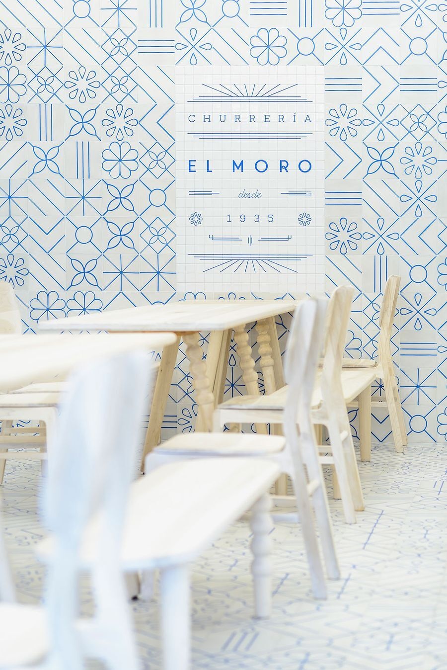 Step inside EL MORO, a historic Mexico City café reimagined with playful blue-and-white tilework, Art Deco touches, and a minimalist palette inspired by sugar and tradition.