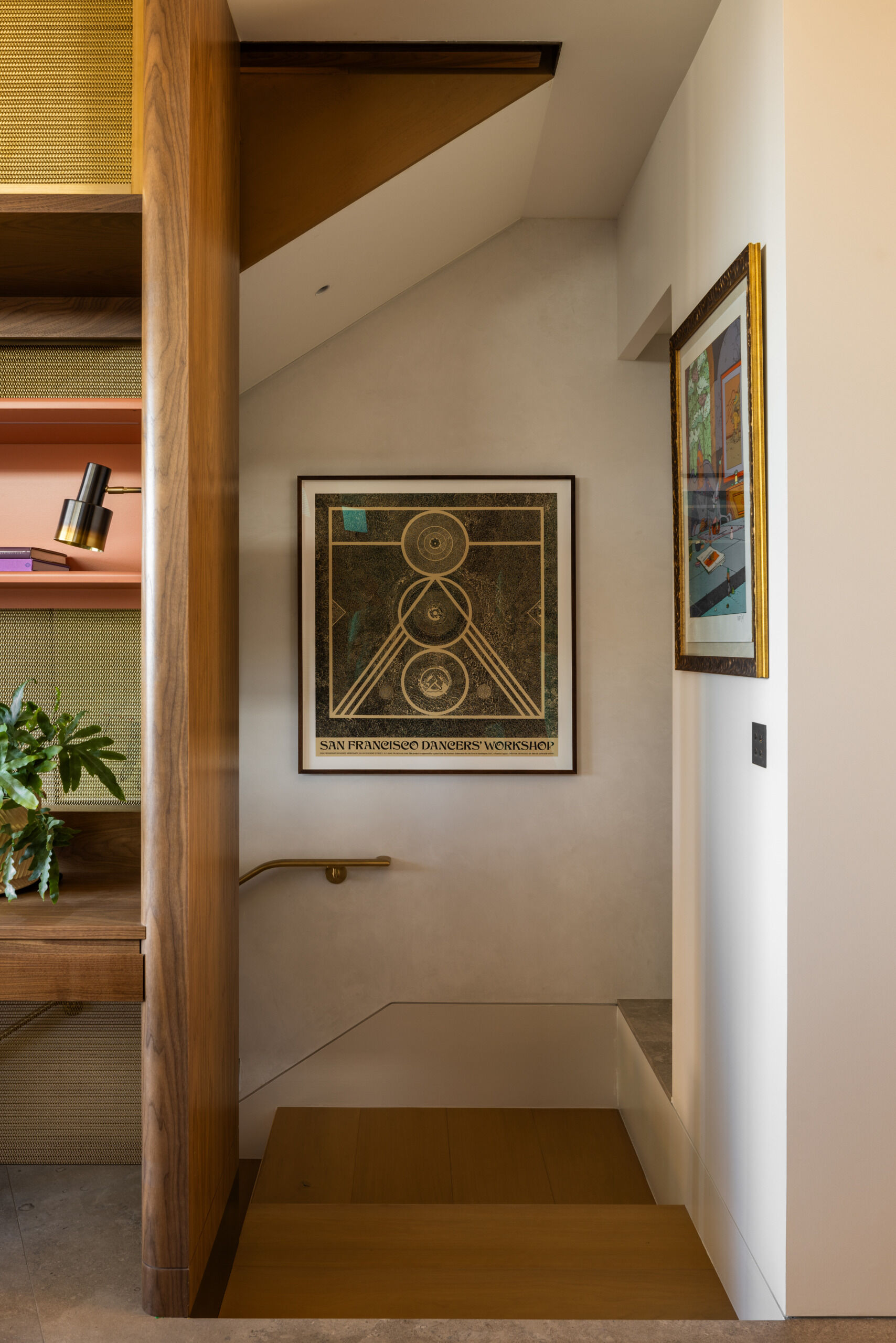 The staircase is a subtle but powerful architectural gesture, uniting the three levels of the home. Custom brass inlays in the stone floors at the base set a refined tone, one that quietly carries through the rest of the design.