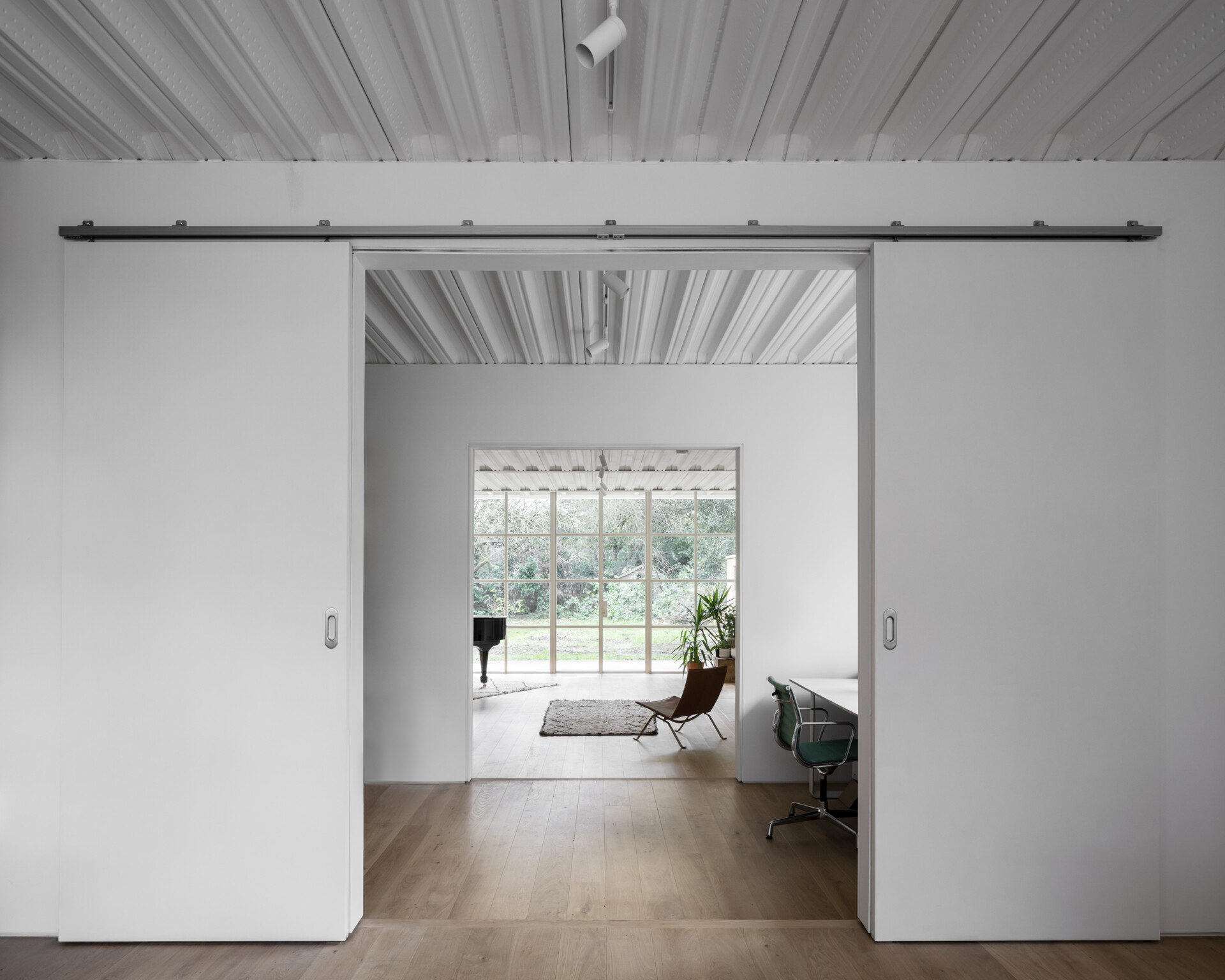 A small, tucked-away study brings balance to the open layout, perfect for quiet focus without straying too far from the rest of the house.